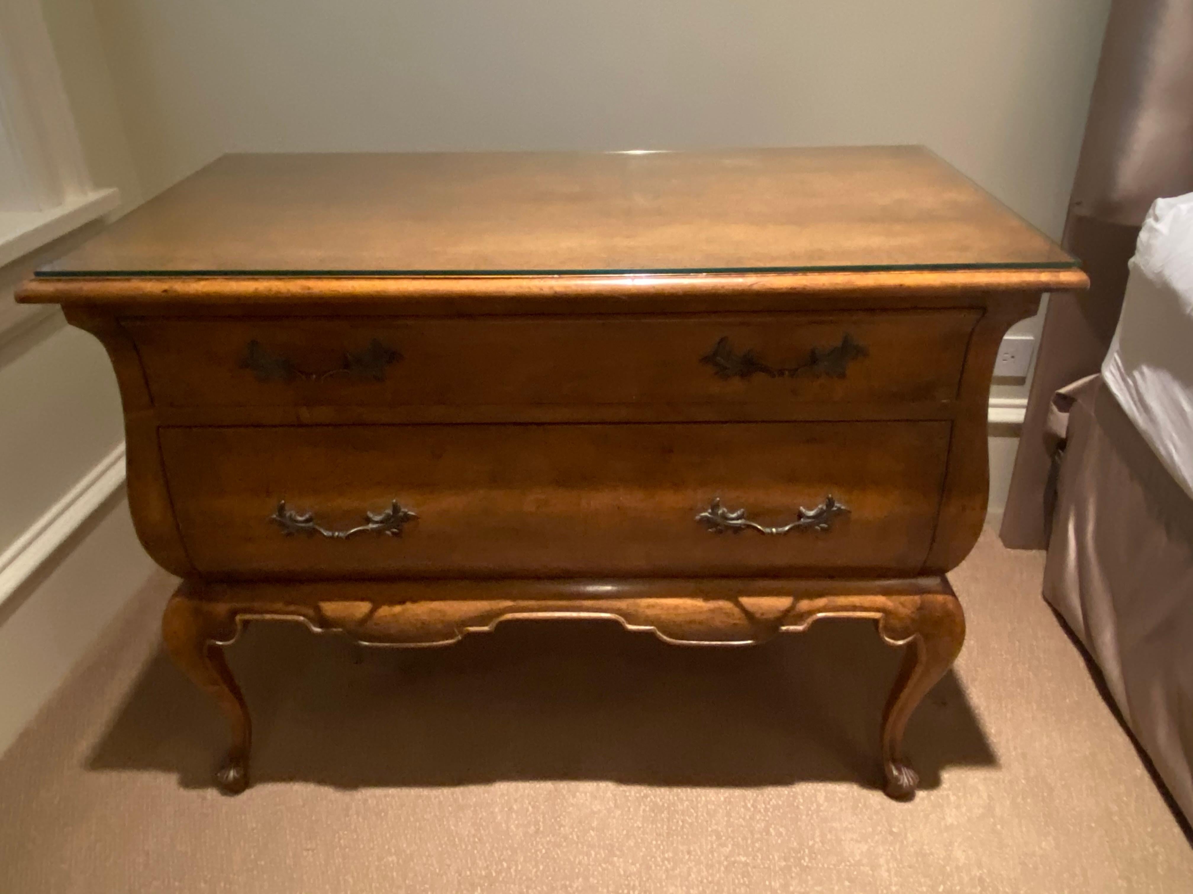 Minton-Spidell Dutch Bombe Chest or Nightstand / 2 available 
Beautifully turned out legs, elegant hardware, honey stained walnut
glass top has protected this piece, and the beautiful blue grosgrain lined drawers make this a special side table,