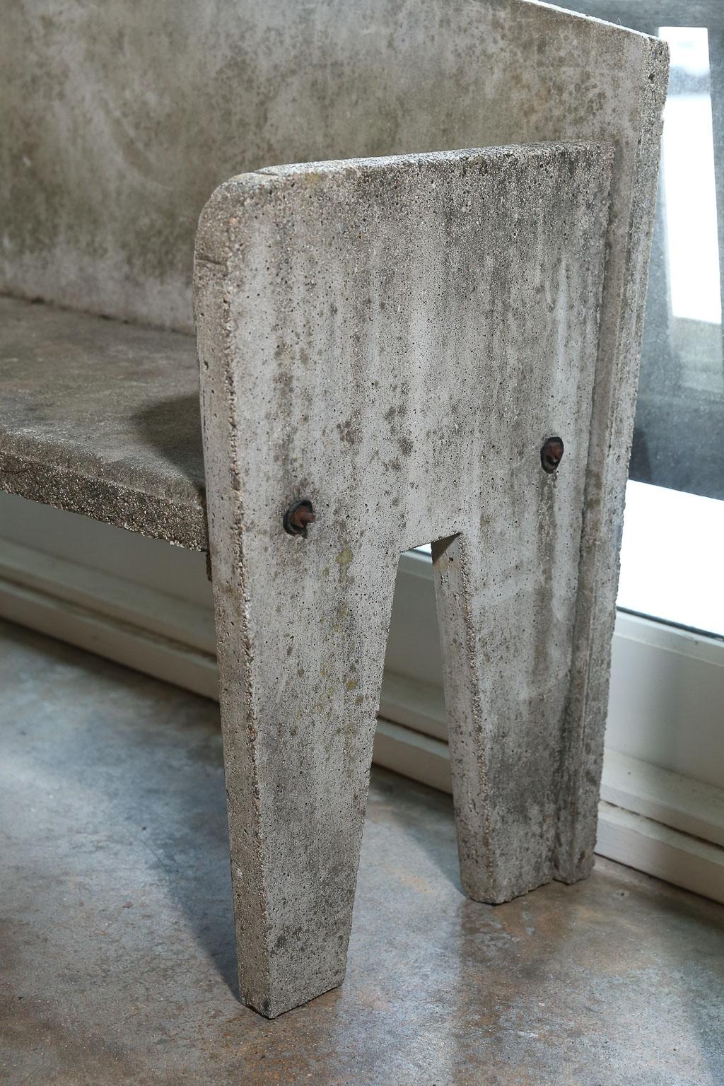 This concrete garden bench, found in Southern France, is perfect for a small patio or garden area. The clean lines make it suitable for any type of outdoor decor. It's unusual, almost midcentury lines, make it one of a kind.