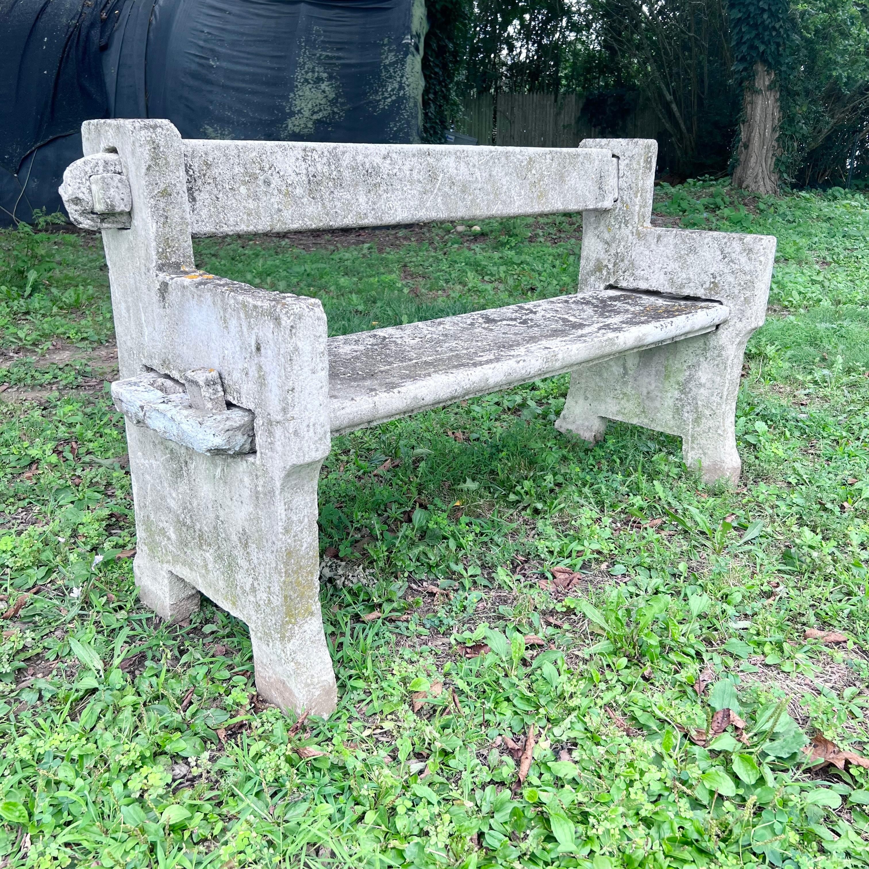Wonderful vintage interlocking concrete bench from France, circa 1950s. Four separate components make up the bench, which all interlock with each other. Years of European weather has given this bench a gorgeous patina, interspersed with lichen. A