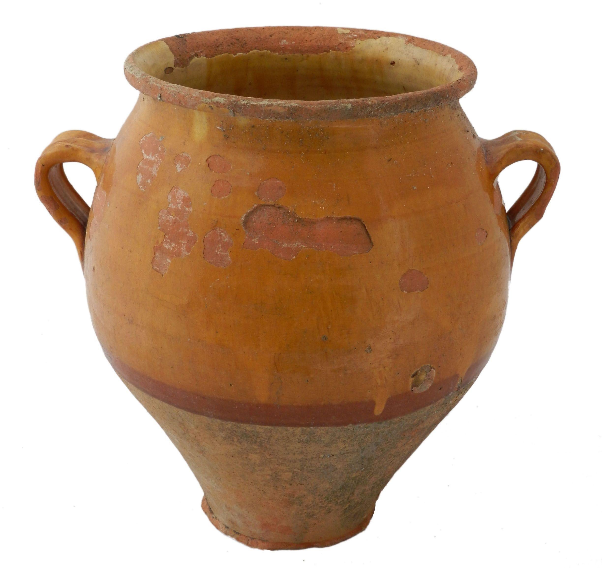 19th century terracotta French confit pot
Traditional large earthenware pottery confit pot from Southern France with yellow glaze
Very decorative
Good patina and bright yellow color with others no holes quite solid
Good antique condition.
