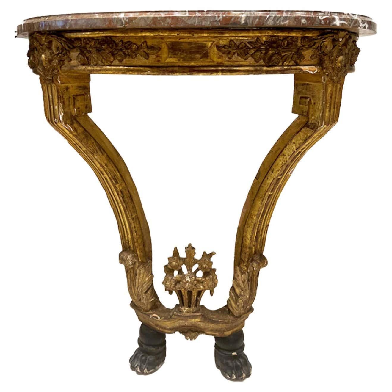 18th century French console with marble top, giltwood carving & black feet.