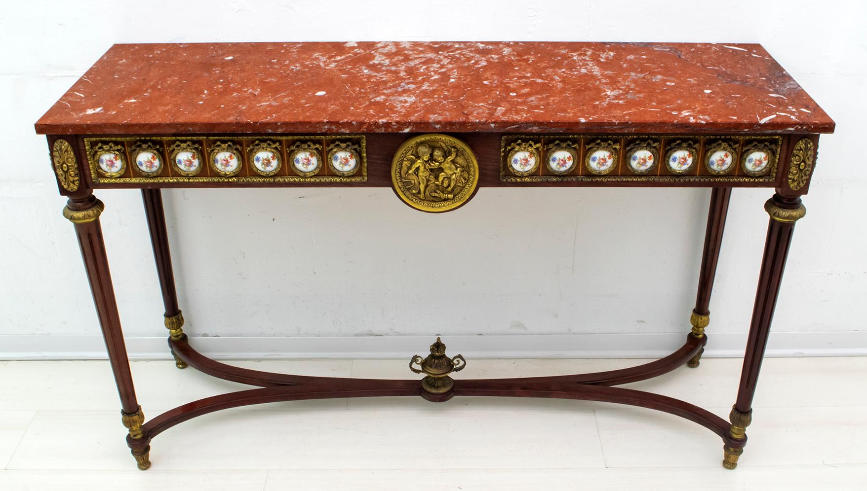 French Napoleon III style console in mahogany with chiseled and gilt bronze trimmings and trimmings, with hand painted porcelain plaques and Verona red marble top.