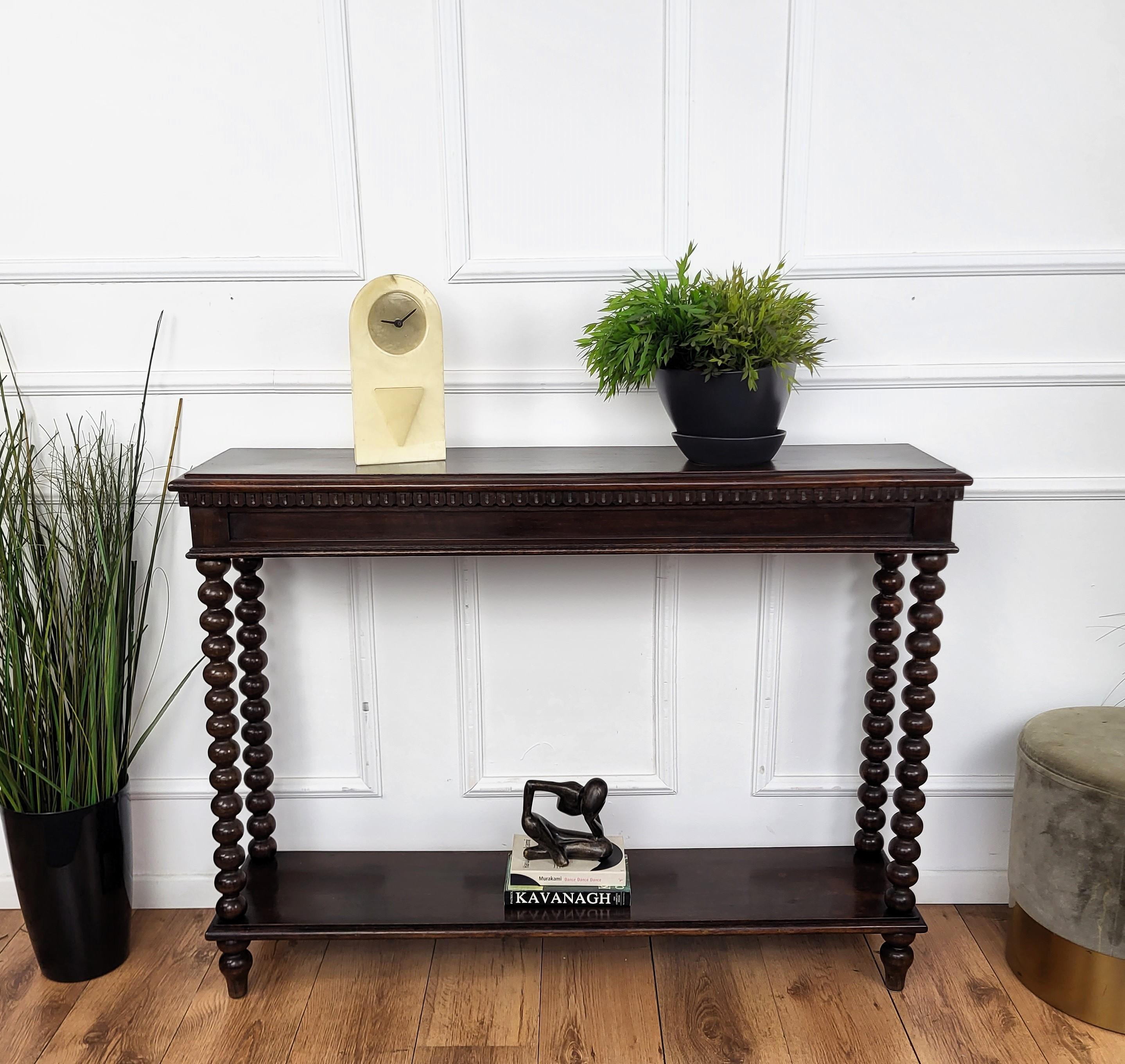 Beautiful console side table characterized by the handcrafted carved decors and beveled top and raised on four stunning Bobbin turned Barley twist carved legs. Finished on all sides, its great shapes and design with the wood patina make it perfect