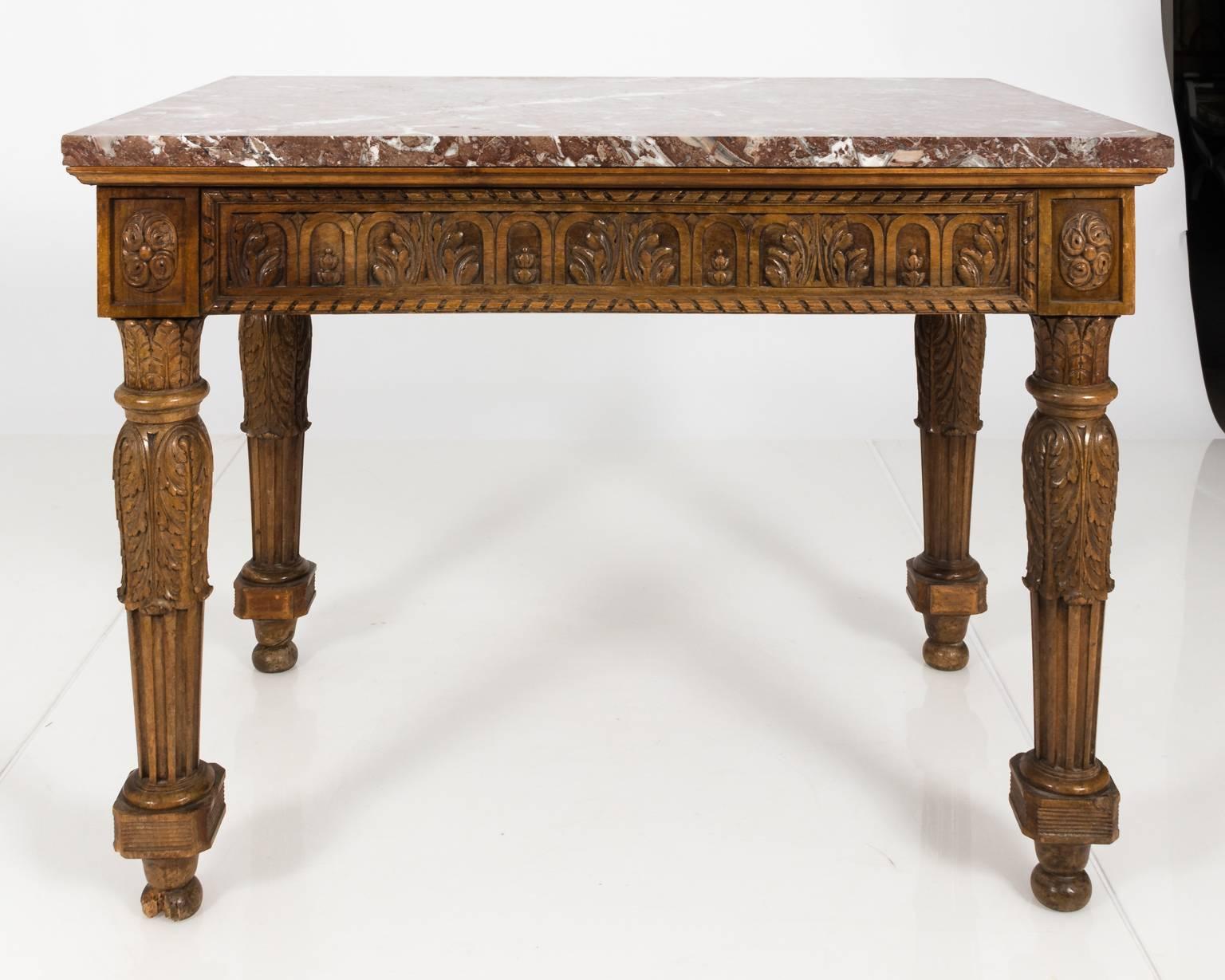 French carved wood console with Arabescato gray rose marble top and a decorative foliage skirt with turned block-and-ball feet, circa 19th century. Please note that one foot worn due to age.
 