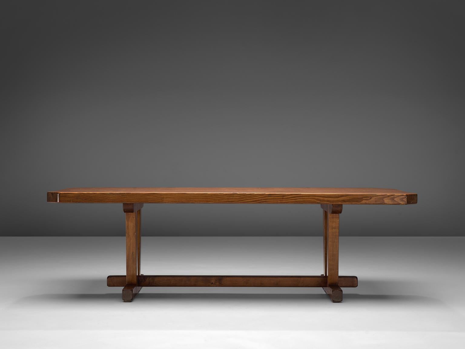 Dining table, made in pine, France, 1970s.

This rustic dining table made in pine has a natural feeling as the wood texture is very pronounced creating beautiful patterns all around the table. The legs are feature a notable construction. The