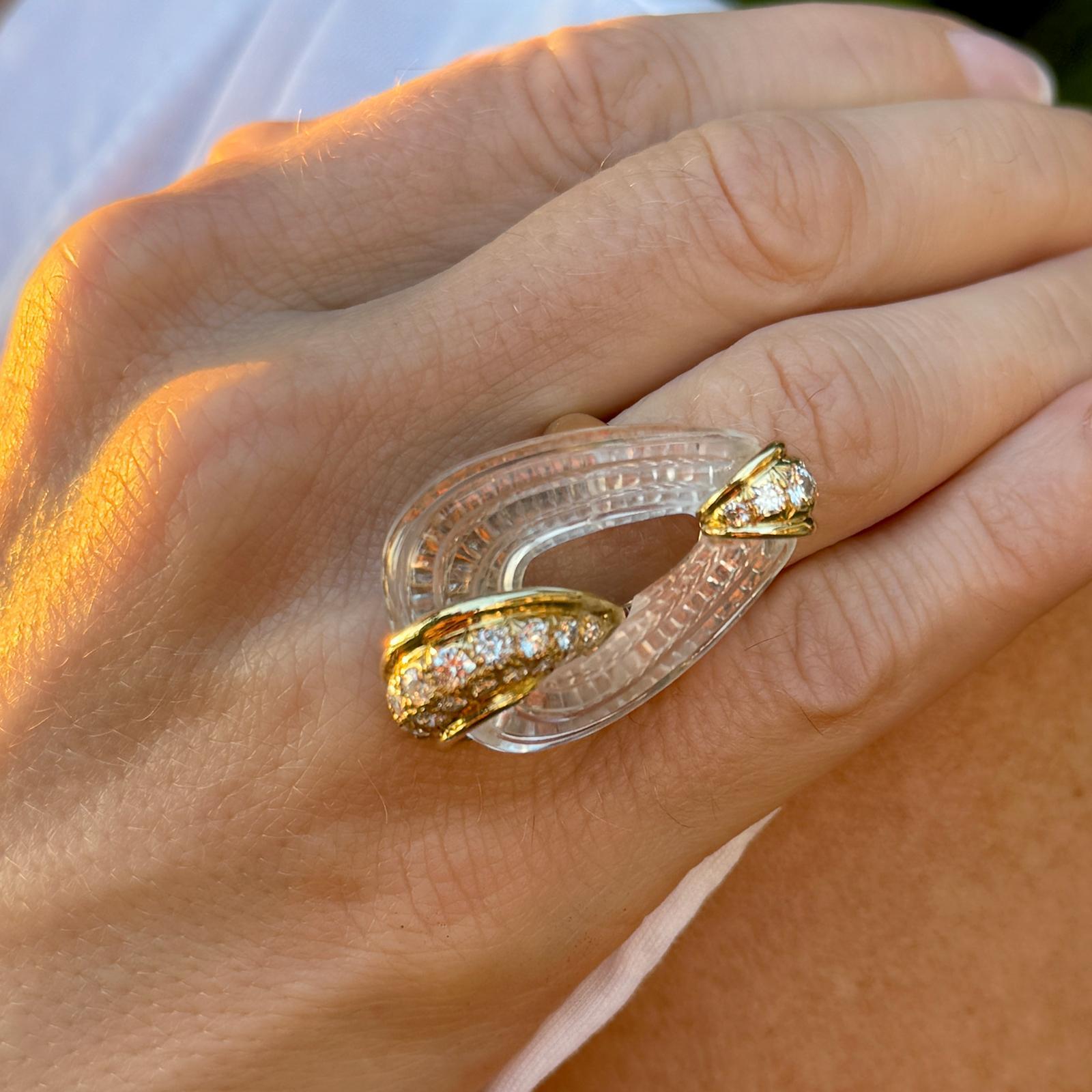 Gorgeous French carved rock crystal and diamond cocktali ring crafted in 18 karat yellow gold. The ring features 21 round brilliant cut diamonds weighing approximately 1.00 carat total weight and graded E-F color and VS clarity. The top measures 20
