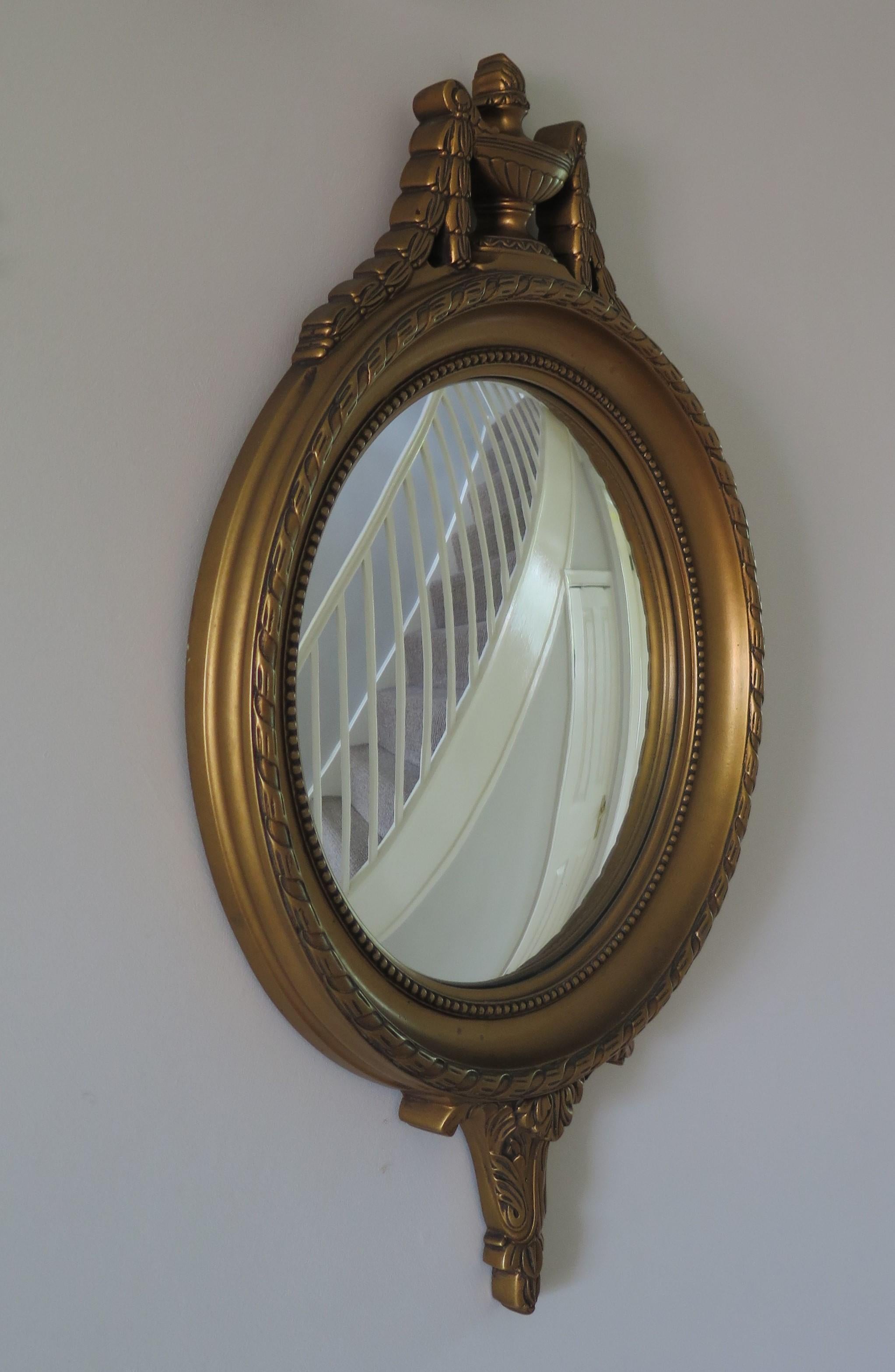 This is a beautiful French convex circular wall mirror in the Empire style of the early 19th century, which we date to Circa 1930s.

The mirror is of good quality with very good detail. 

The convex mirror plate is in very good condition.

The