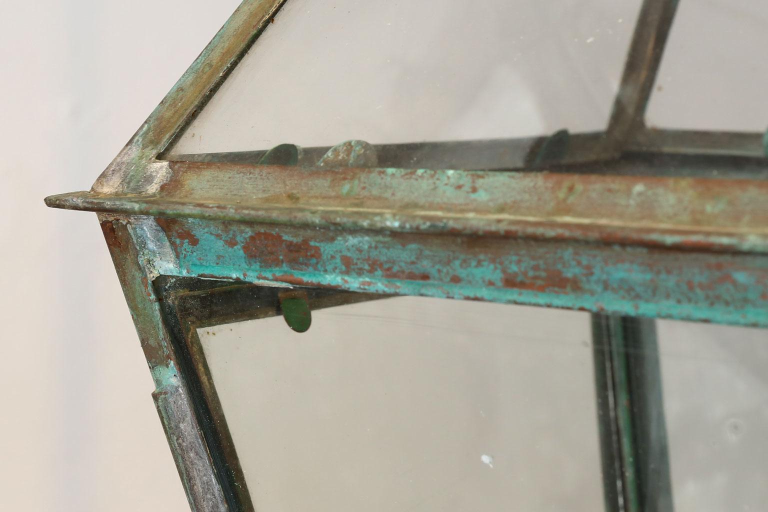 Green-verdigris copper and brass lantern with glass panels dating to the late 19th century. This French lantern can be wired for electricity or fitted for usage with gas for an additional cost.