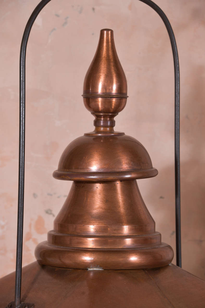 19th century French copper lantern with glass panels. Lanterns can be wired for electricity or fitted for use with gas for an additional cost.

Note: Original/early finish on antique and vintage metal will include some, or all, of the following: