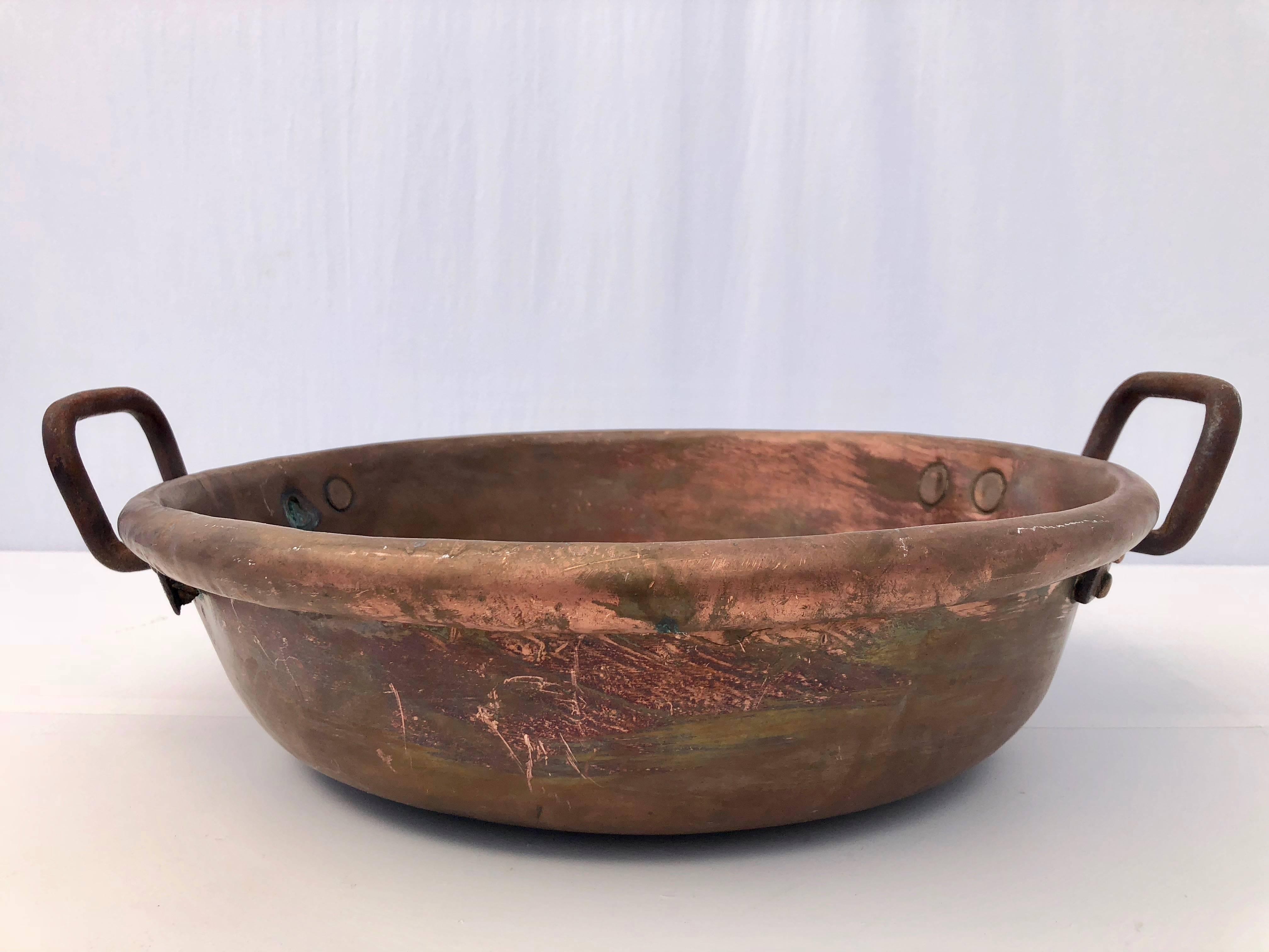 This French antique copper preserving pan with wrought iron handles was used to bake jam or other sweet food in the 1800s. The three reasons why these copper pans work so well is that it- evenly spreads the heat and, since most fruit contain pectin