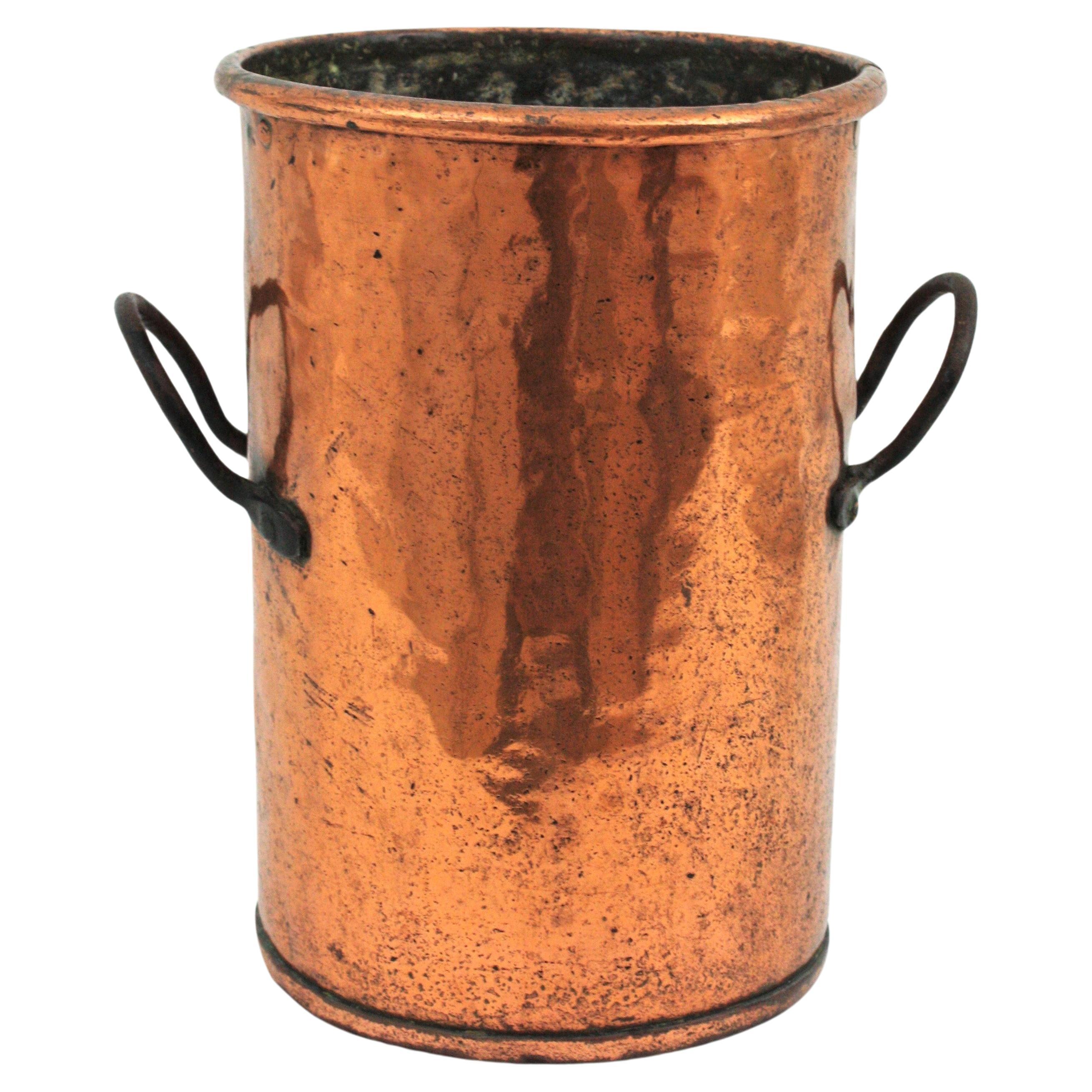 Antique hand-hammered tall copper cauldron with iron handles. France, 1930s-1940s
This handcrafted copper cauldron has a nice design and a terrific aged patina. The copper is heavily marked by the pass of time and it has a strong visual effect.
Iron