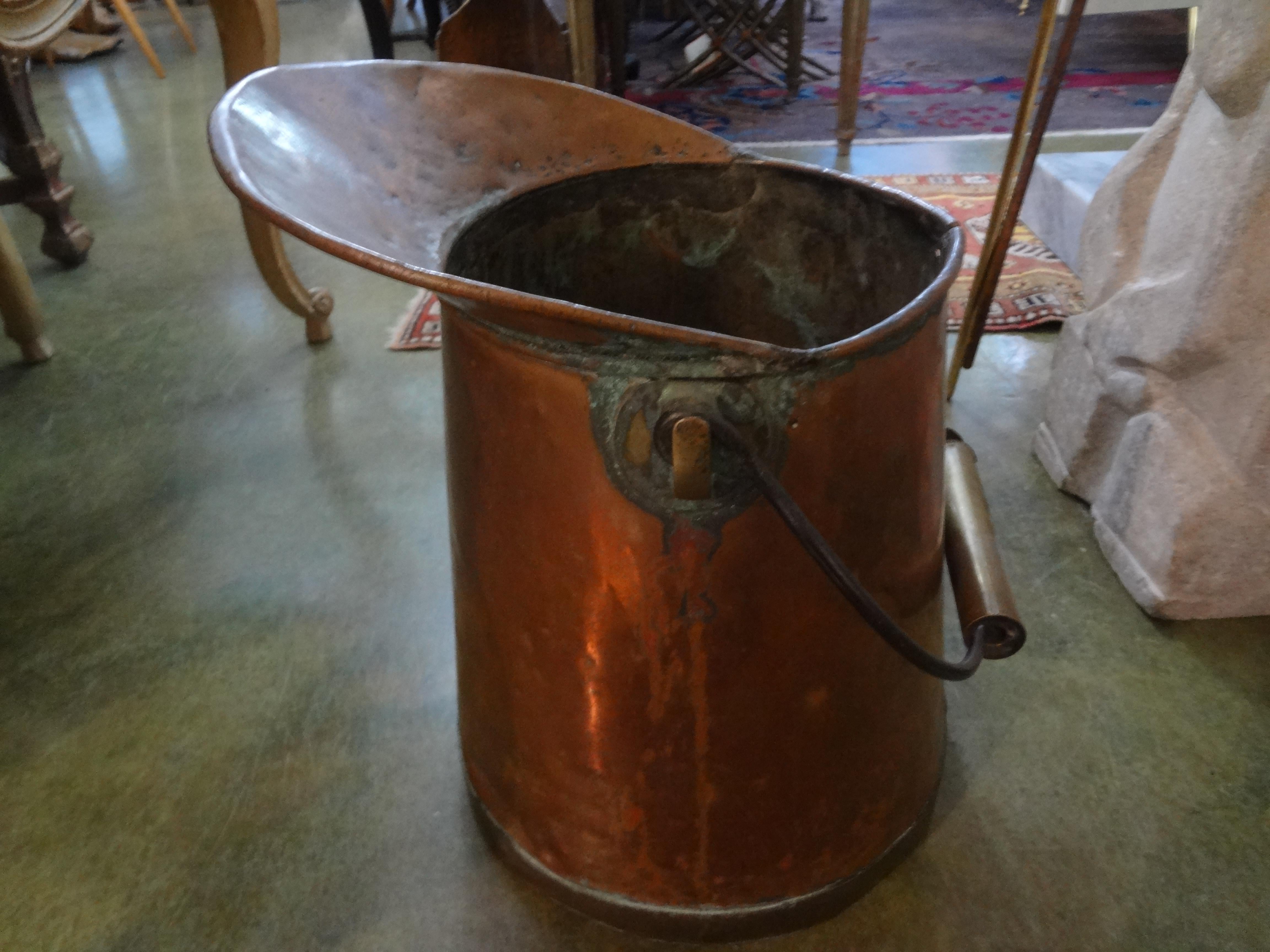 Beautiful French country copper watering pitcher with brass trim. This great French rustic copper pitcher would make a great garden accessory, indoor decorative accessory or as a vase or vessel for flowers.
