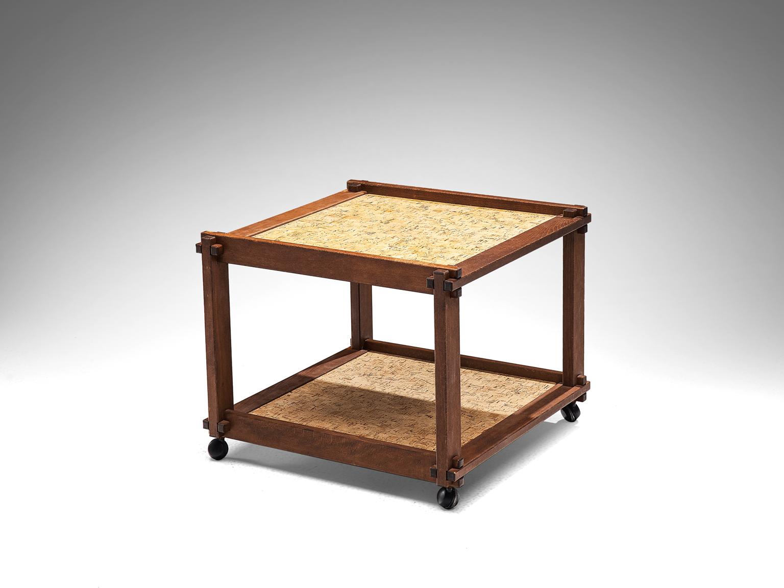 Trolley, cork and wood, France, 1950s.

This solid bar cart has been executed with a cork top and a cork bottom shelve. The piece has a solid wooden frame that has patinated over time and forms a warm, striking contrast to the cork elements. The