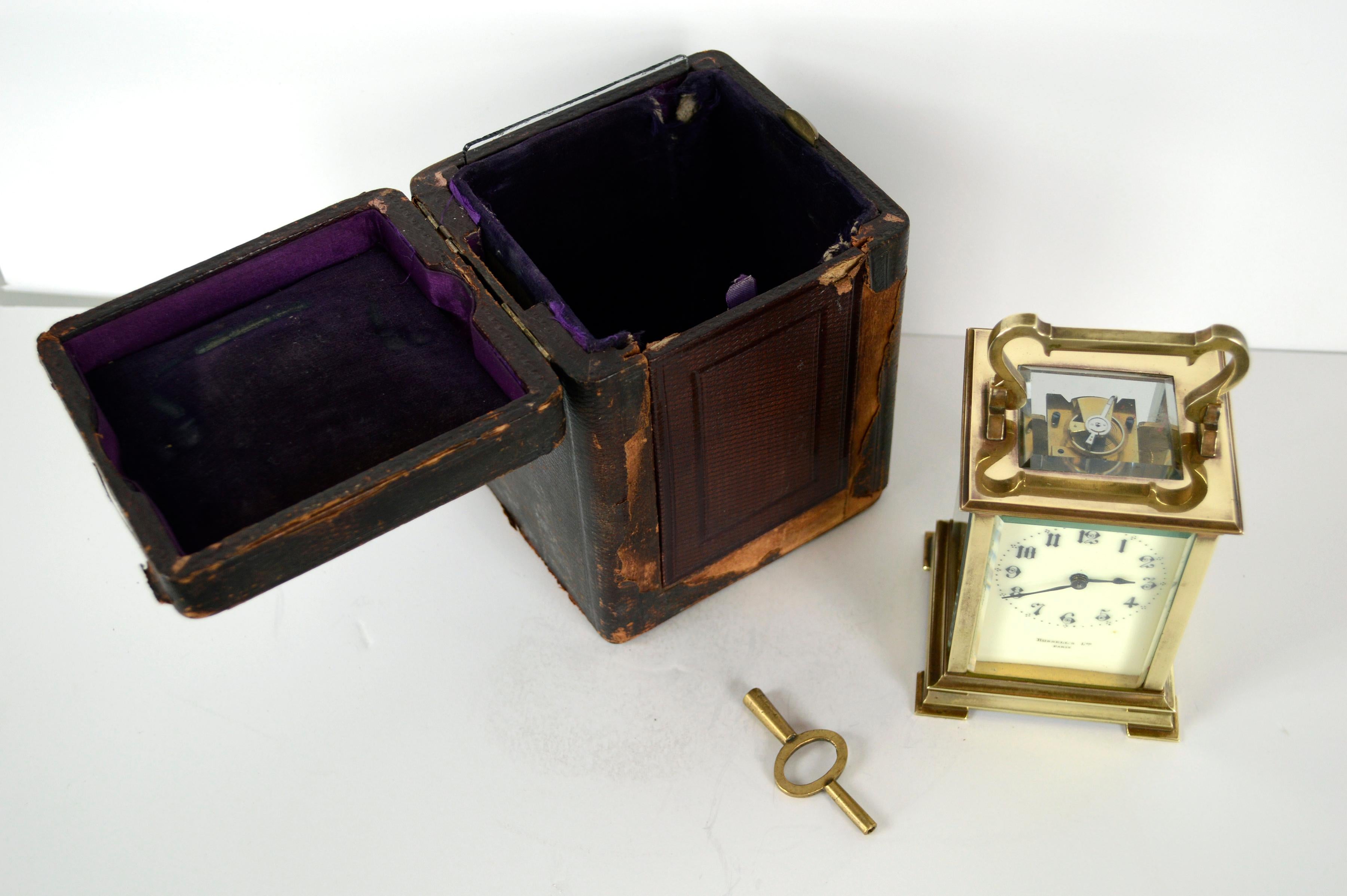 A wonderful late 19th-century brass carriage clock with it's carrying case and winding key sold by Russell's Ltd. (England/France, founded 1848), c.1890s. Signed on the dial 