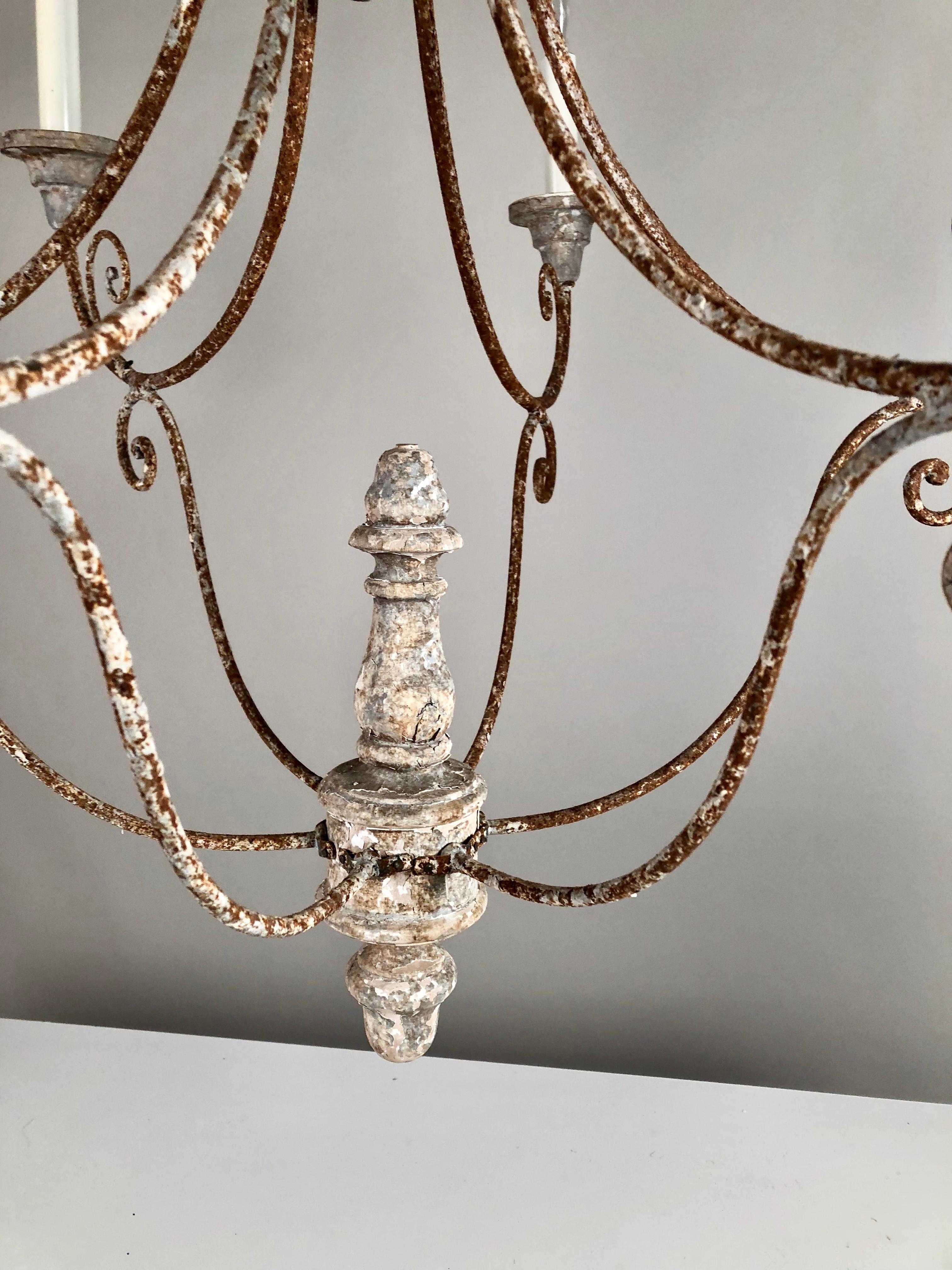 A wood and tole 6-arm chandelier, comprised of antique elements. Recently re-wired.
