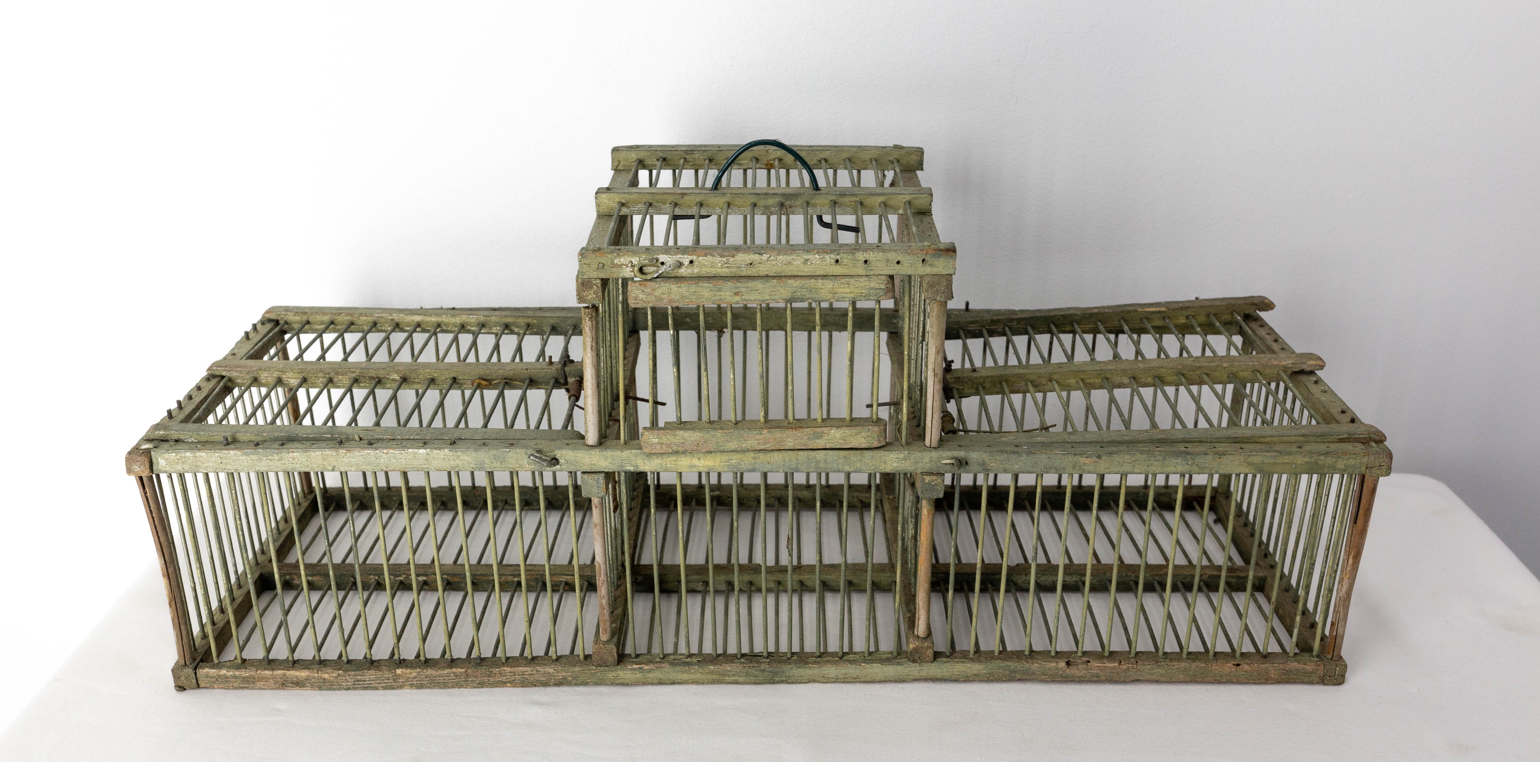 French bird-cage 
The smallness of the cage is explained by the use of the cage to transport birds. It is divided into three compartments.
Circa 1900
Good condition.

Shipping:
L 54 P19 H 23.5 1.3 Kg.