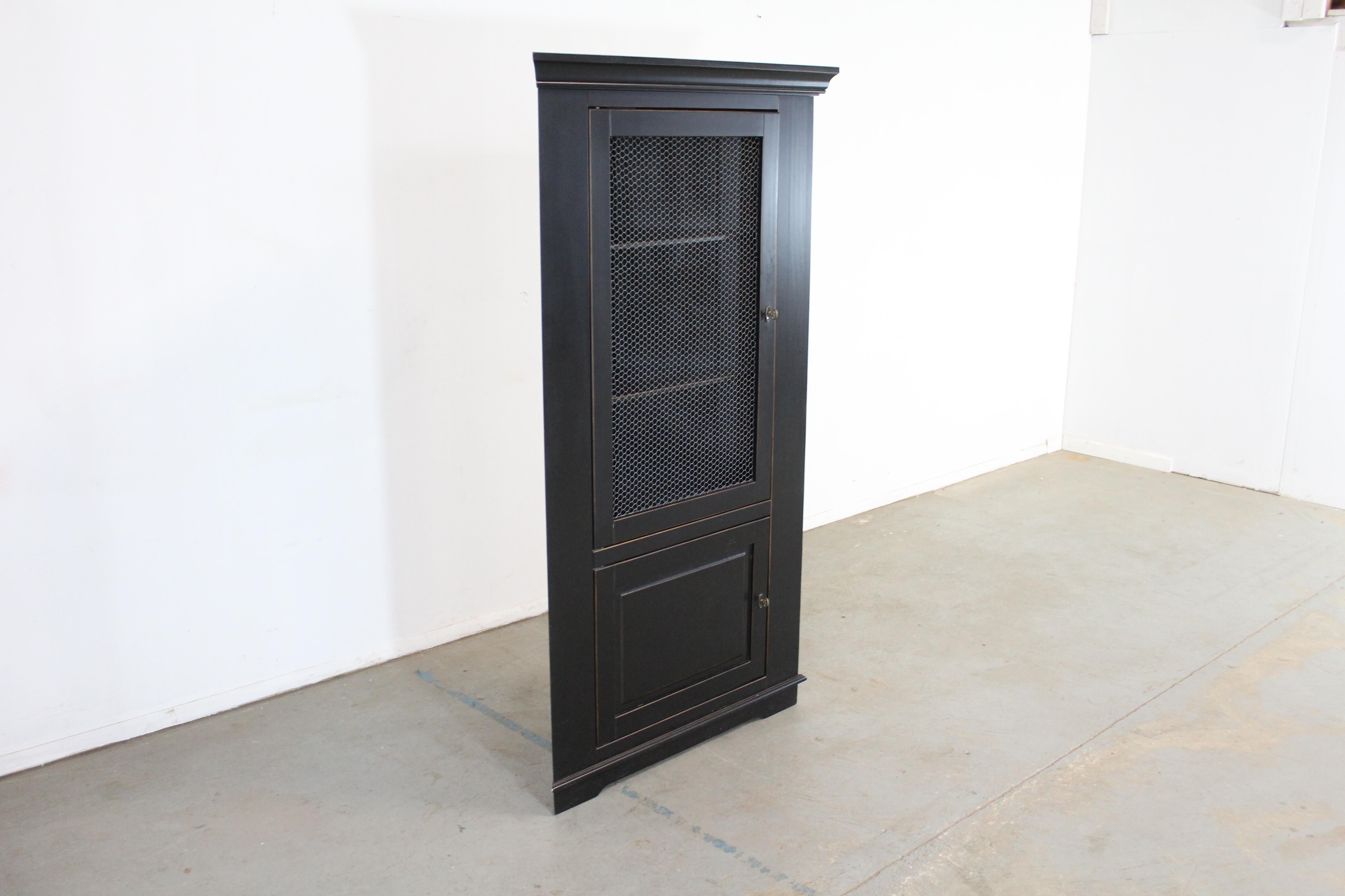 French Country Black Corner Cabinet By Ballard Designs

Offered is a French Country Black Corner Cabinet By Ballard Designs. It is in good condition with slight age wear. It is structurally sound. Review photos carefully and message us for