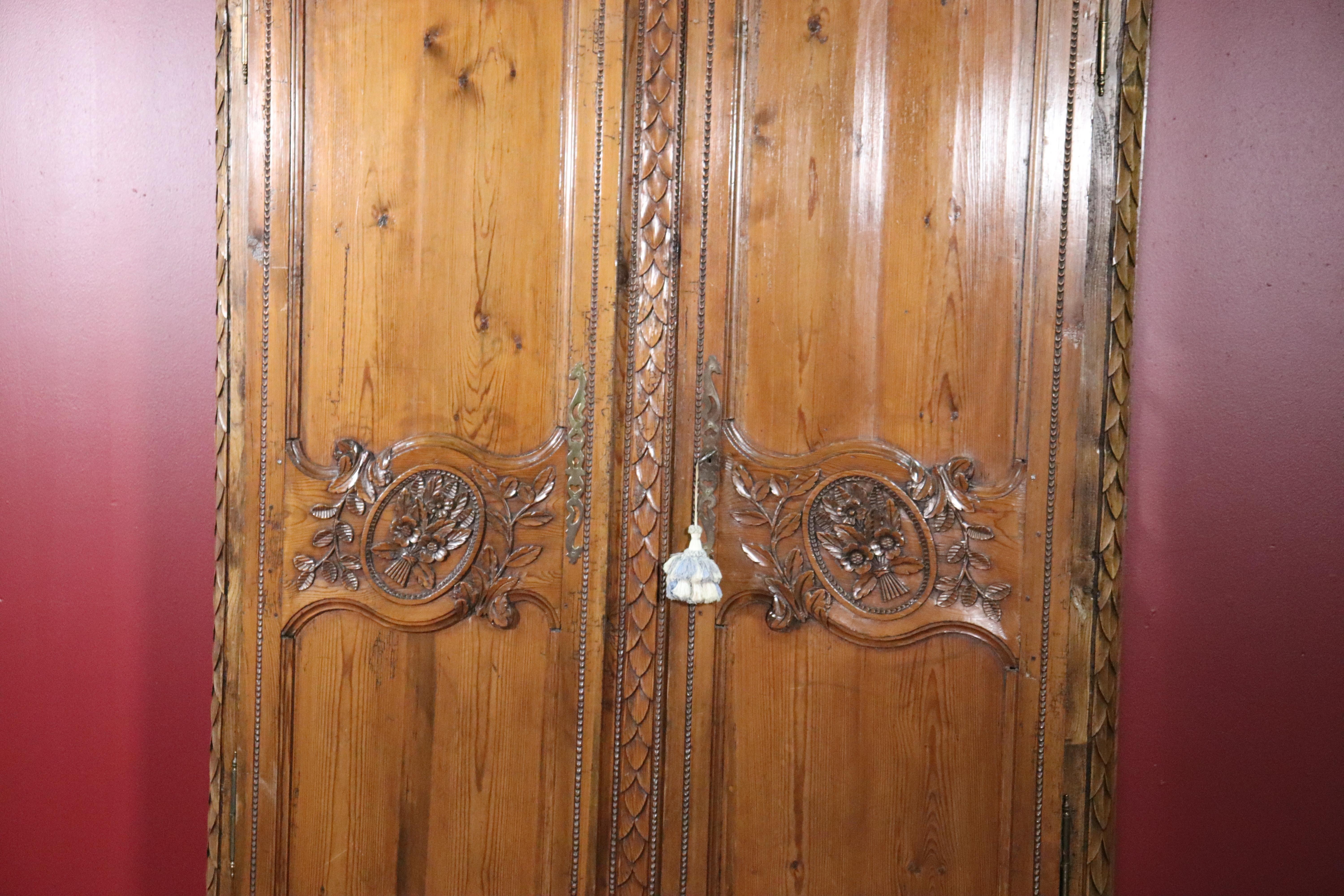 French Country Carved Pine Wedding Armoire Wardrobe with Basket of Flowers In Good Condition In Swedesboro, NJ