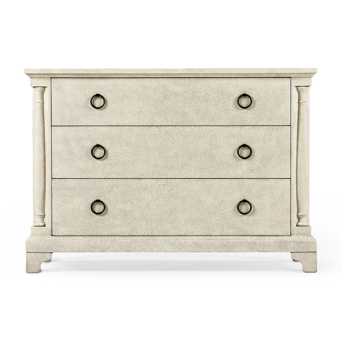French Country rustic chest of drawers in our whitewash driftwood finish with three drawers, column form styles, with a stepped pedestal base on bracket feet and brass ring handles.

Dimensions: 47.25
