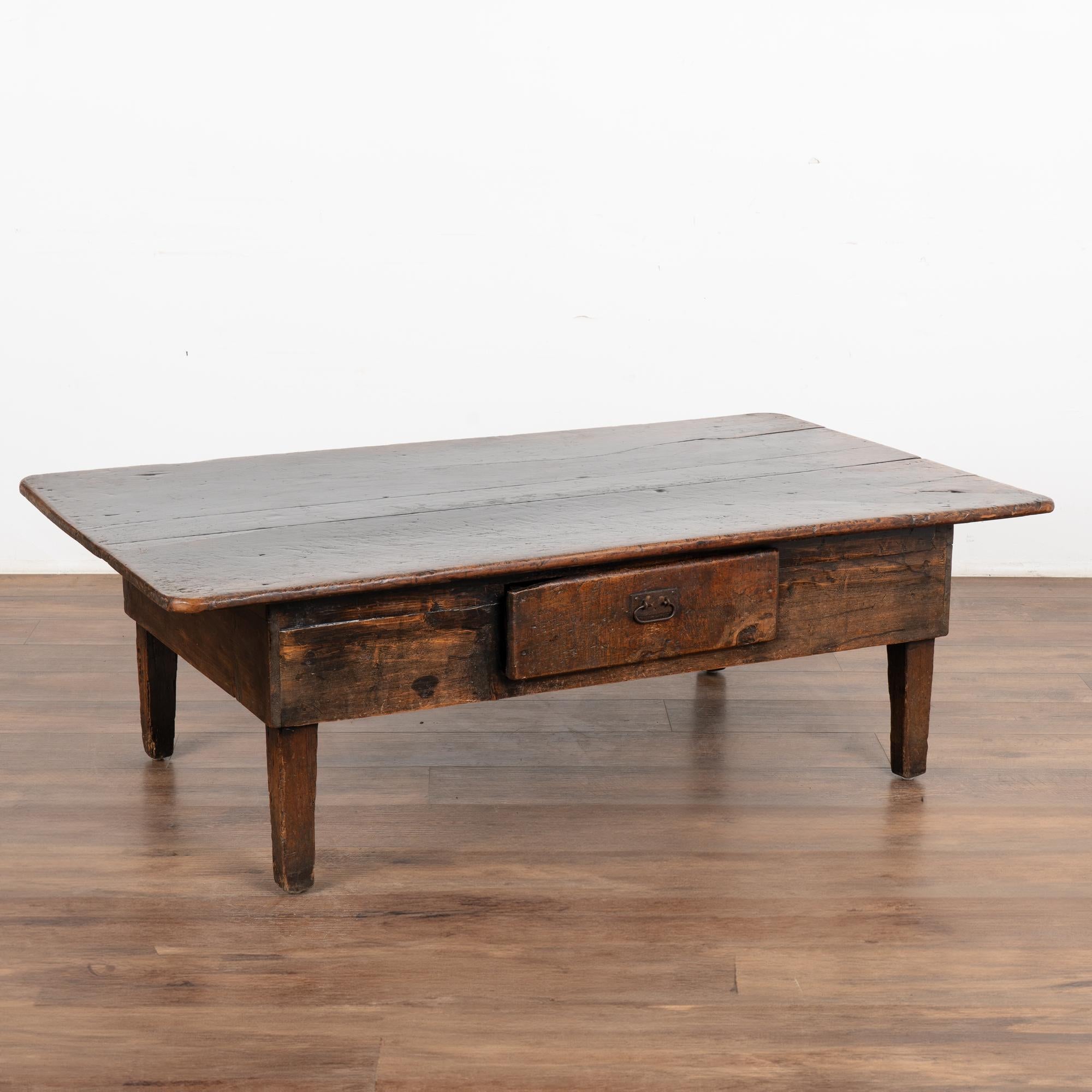 The beauty of this French country coffee table with one drawer comes from the warm aged patina of the chestnut wood. Every crack, ding, gouge, old knot and stain all add to the depth and richness found in the worn top.
Restored, strong and stable;