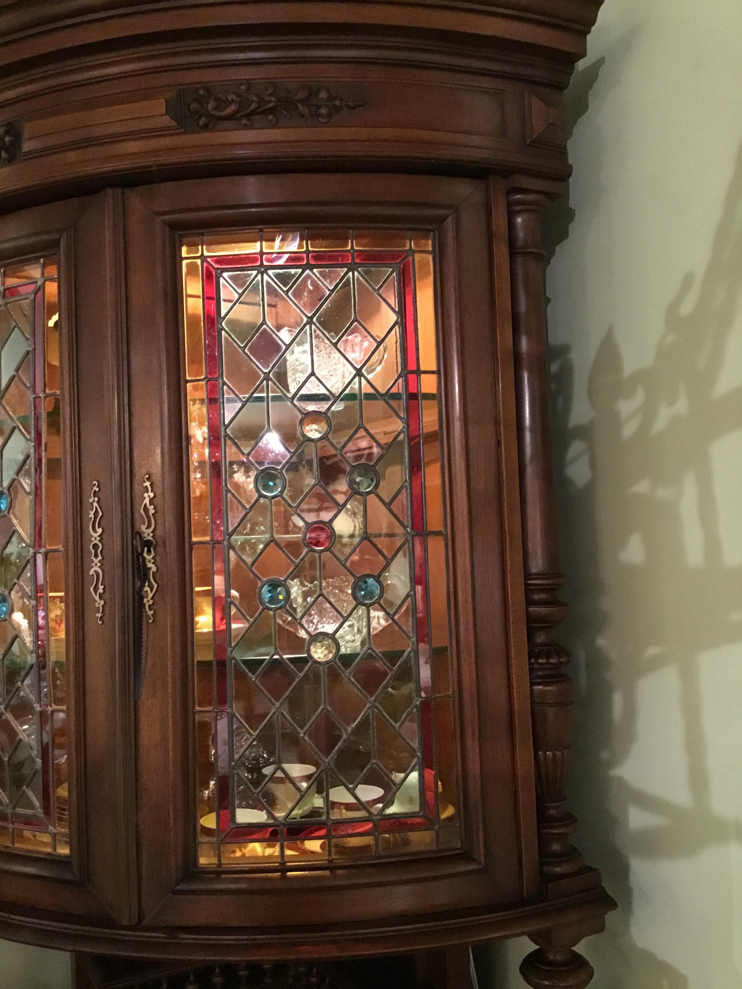 antique corner cupboard with glass doors