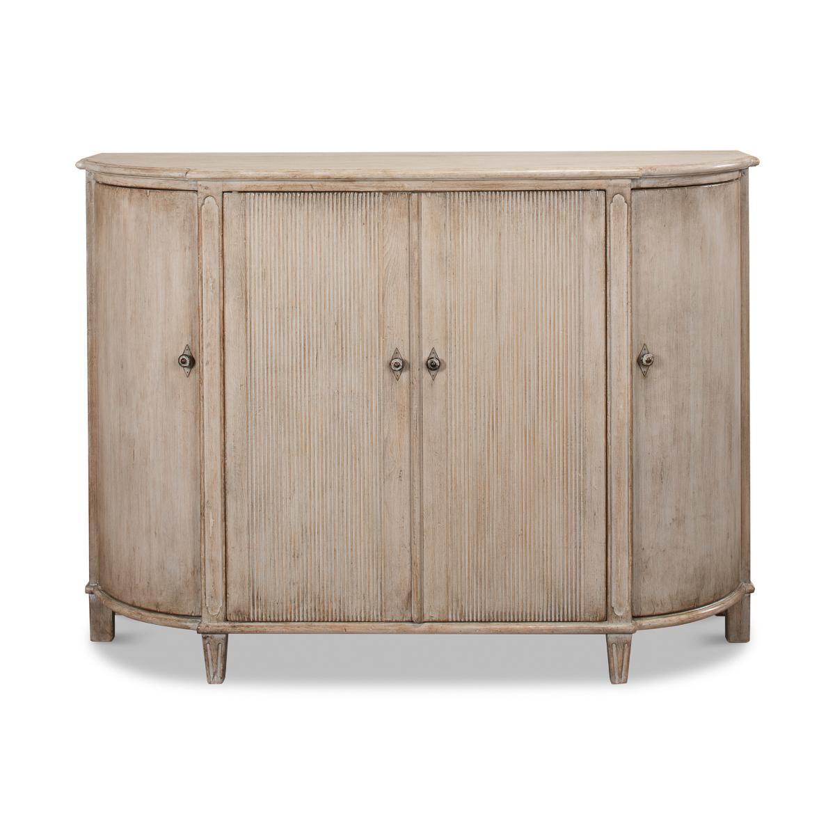 French Country Demilune Cabinet with a stone grey rustic painted finish on pine with curved doors to the sides and two reeded center doors, each section fitted with shelves. 

Dimensions: 63