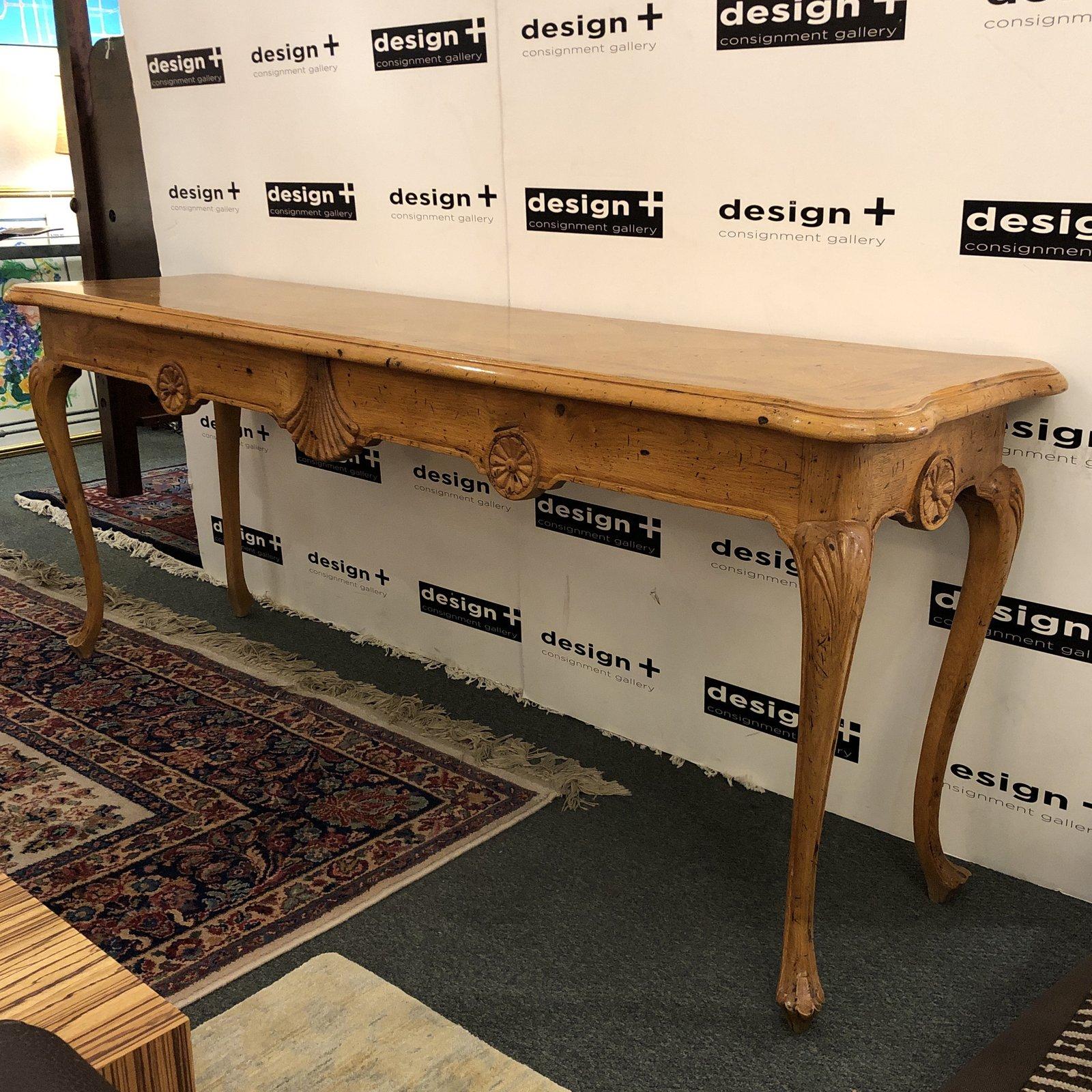 An extra-long French country console. Beautiful parquet inlay, carved details and the soft curves indicative of the style, the table offers amazing function as a sofa table, below a flat screen or in a hallway entry.