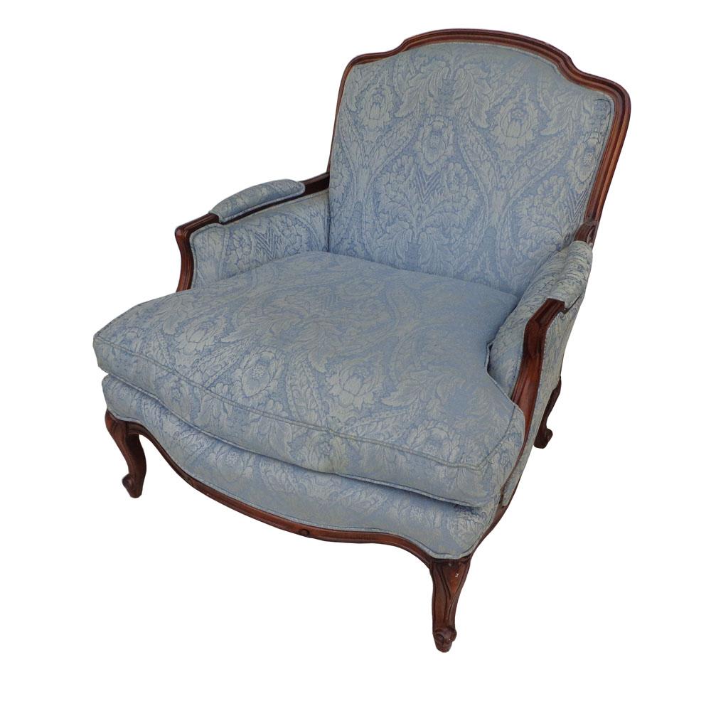 Vintage wide frame French country bergere lounge chair

 Vintage wide frame Louis XV style carved arm chair with cabriole legs. Original blue Damask upholstery with down filled cushions.
 
 
Measures: Arm height: 22.5