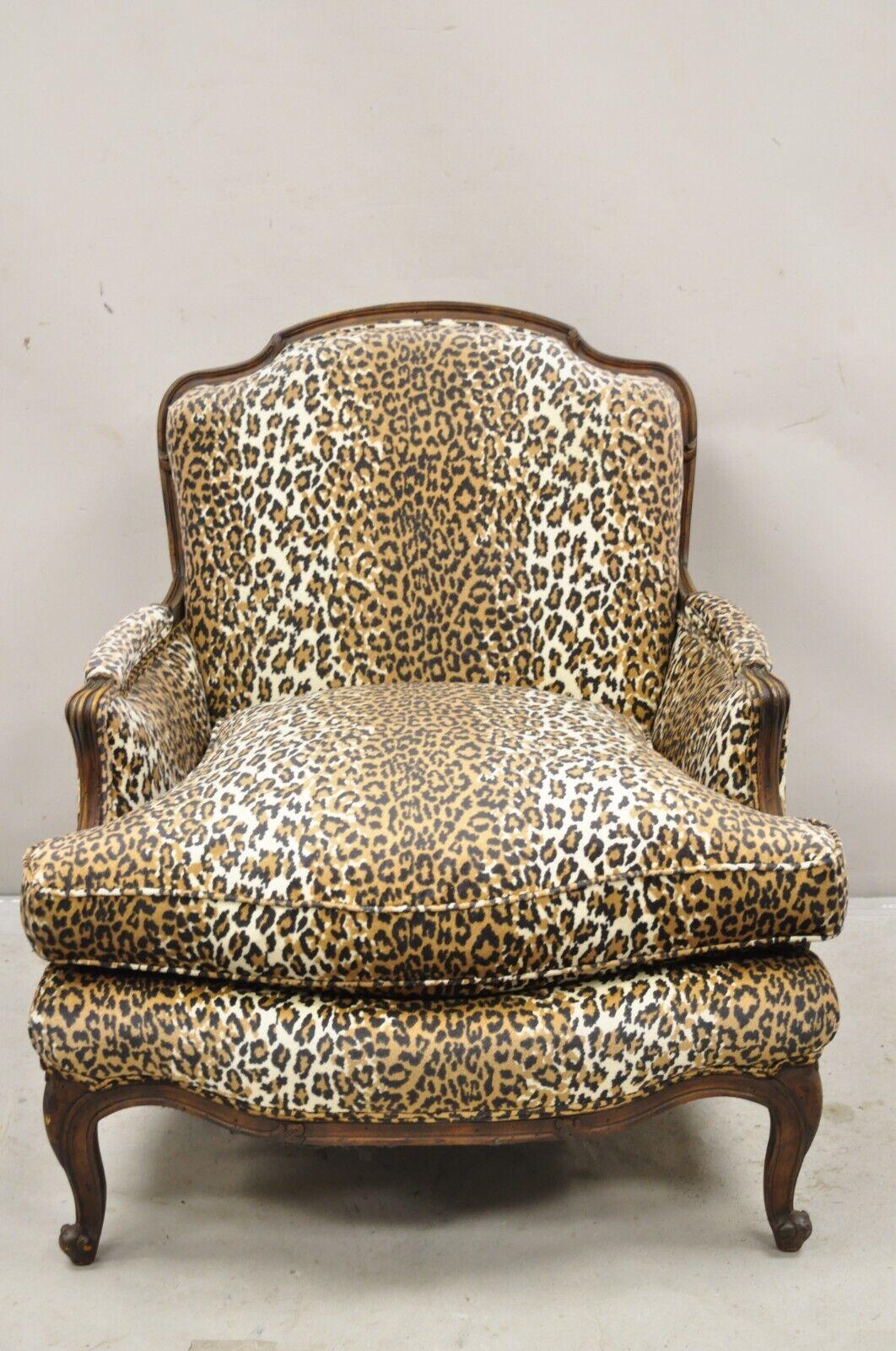 French Country Louis XV Style Cheetah Print Upholstered Bergere Club Lounge Chair. Item features a solid carved walnut frame, distressed finish, nice overstuffed form, high quality vintage chair. Circa Mid 20th Century. Measurements: 36