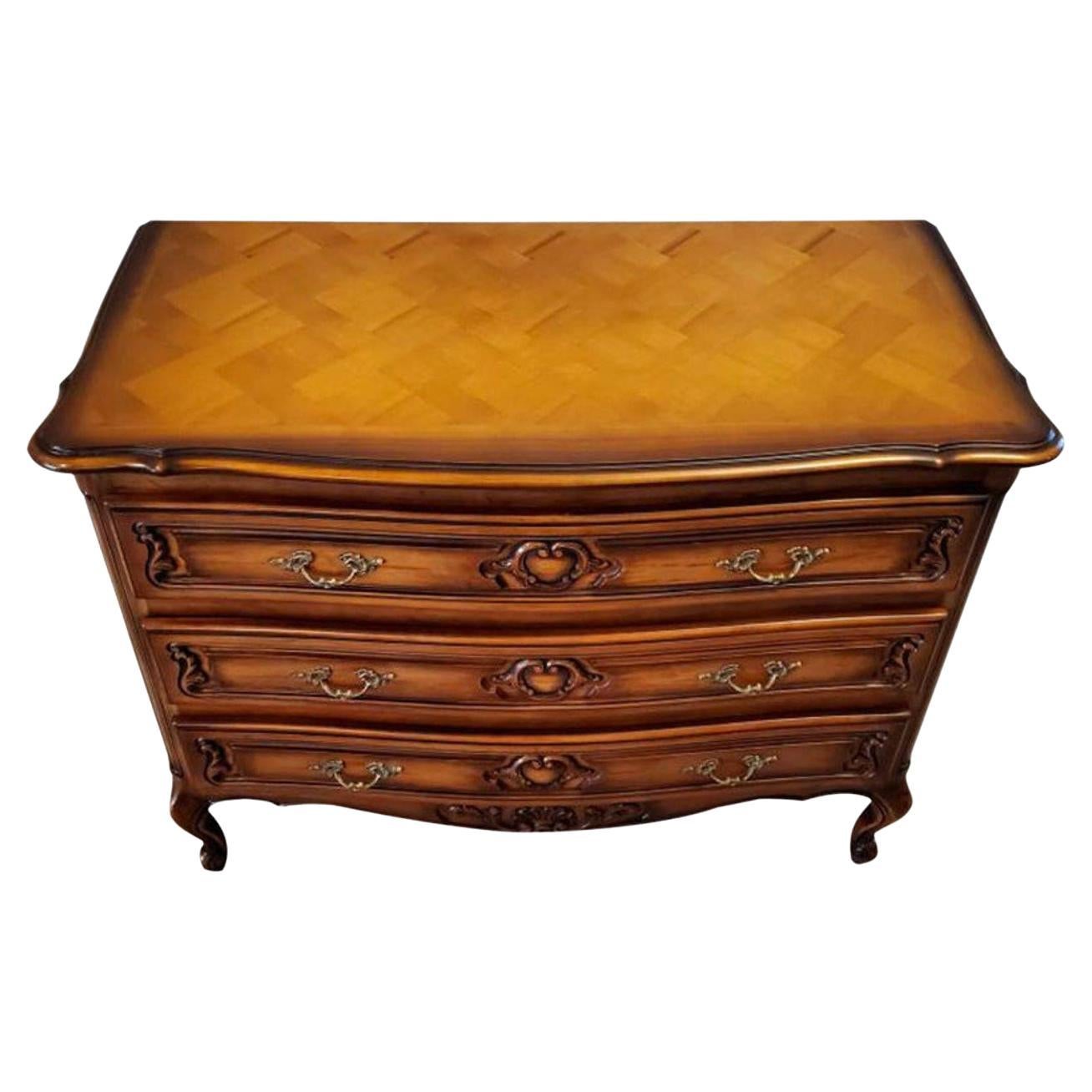 A stunning, very fine quality, fruitwood chest of drawers, featuring superior craftsmanship, superb detailing and elegant decorative accents, this vintage French chest of drawers (bedroom commode - dining room server sideboard - buffet - credenza -