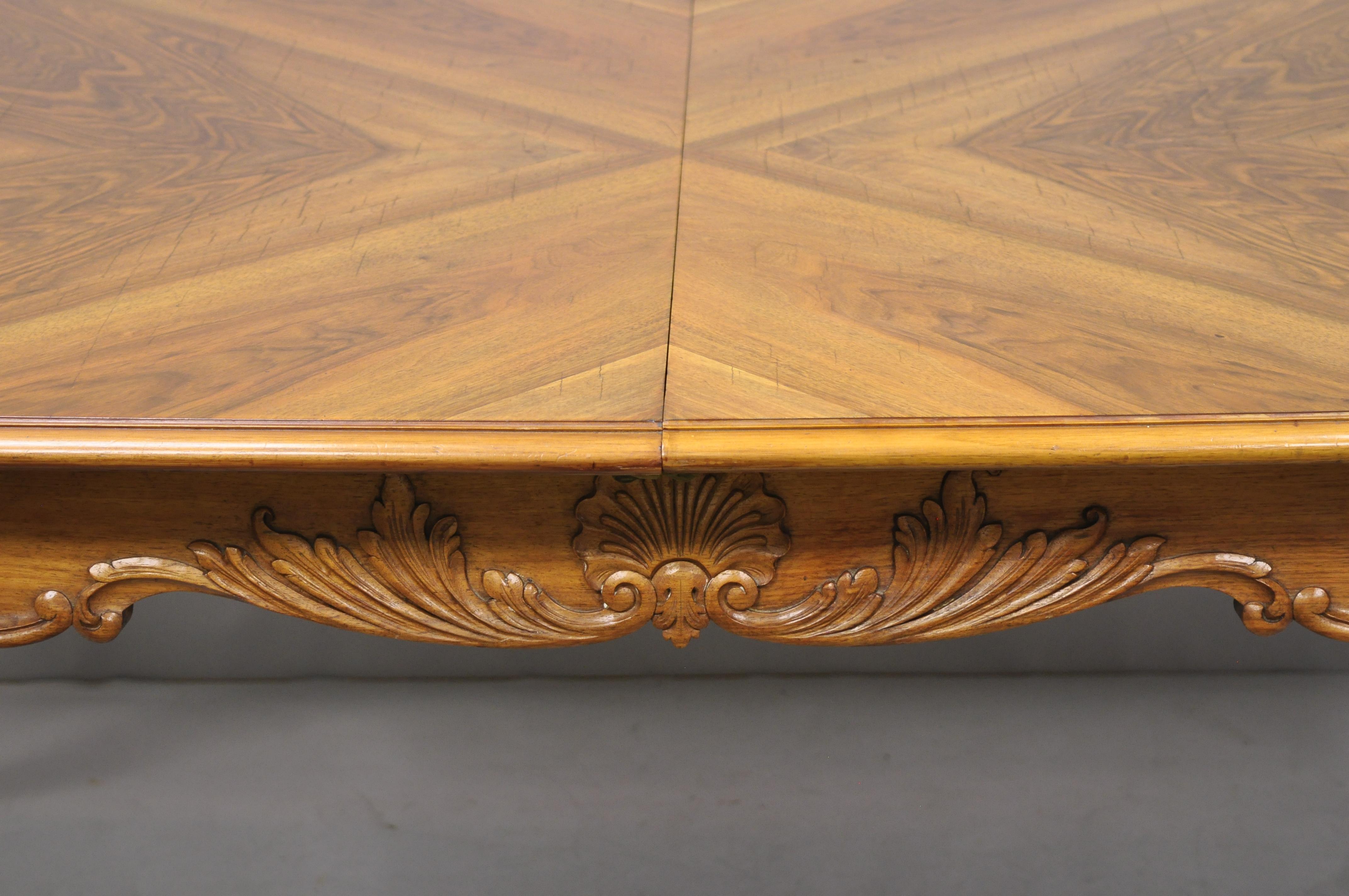 20th Century French Country Louis XV Style Shell Carved Walnut Dining Table with Two Leaves