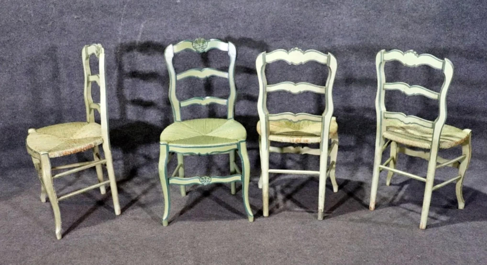 Set of six painted ding chairs with rush seating. Solid wood chairs in a French country style with woven seating.
Armchairs: 36 1/8