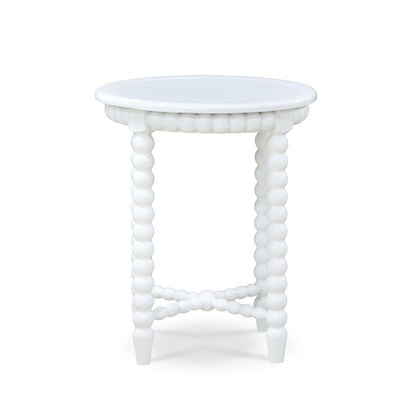 A timeless piece that seamlessly combines rustic charm and elegant design. This round end table features a solid wooden frame finished in a lightly distressed architectural white painted finish, providing both durability and classic appeal. The