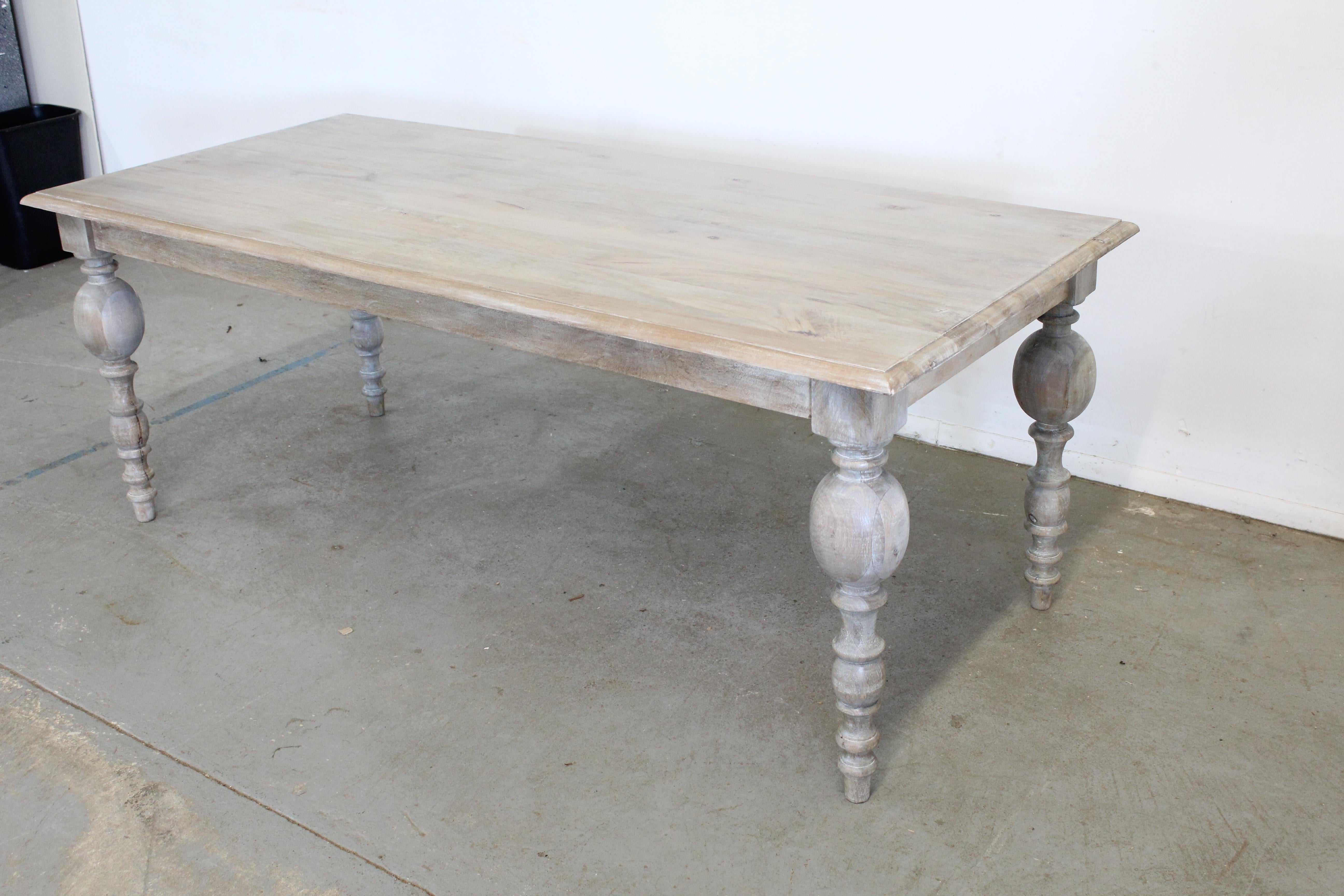 Offered is a solid wood French country dining table. It has a great look to it with carved legs and a rustic finish. This piece has never been in a home and is a floor model. Each table has a rustic finish and will have slightly different tones.