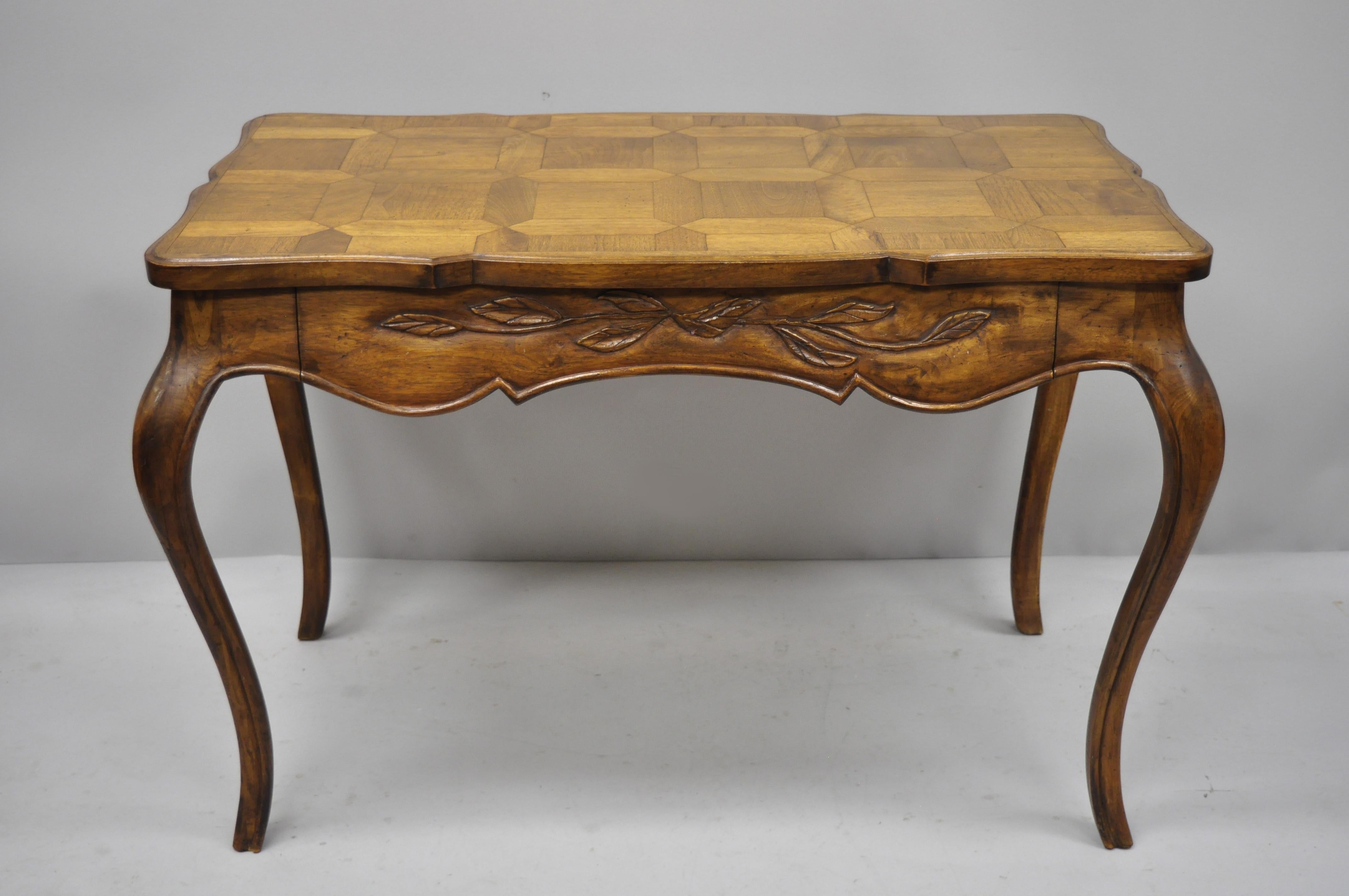 Vintage French Country Provincial one drawer writing desk with parquetry inlaid top. Item features parquetry inlaid top, beautiful wood grain, 1 drawer, cabriole legs, great style and form, circa mid-20th century. Measurements: 29