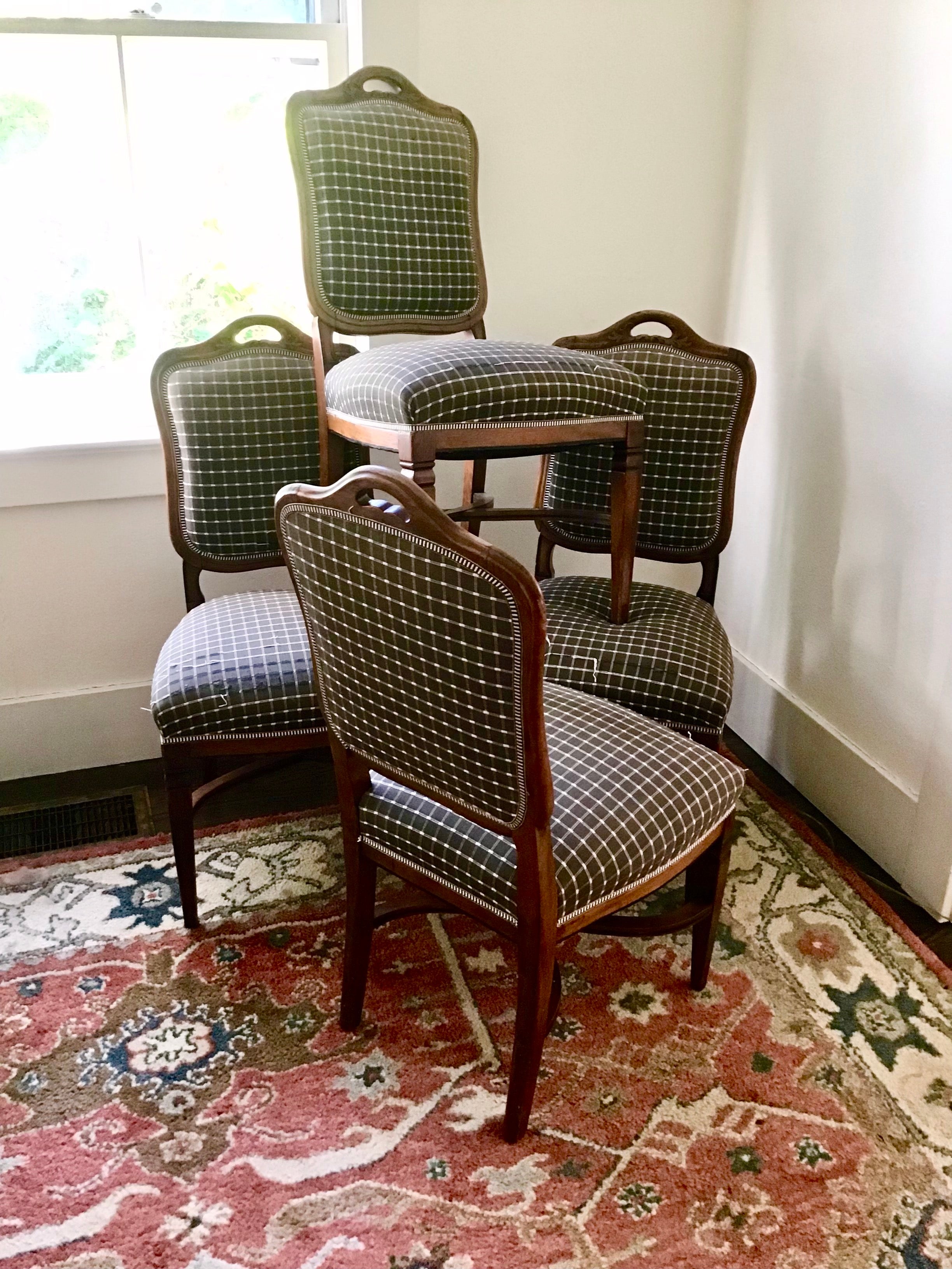French country provincial style dining chair set is in good structural condition. Lovely simple design with some painted details on wood, which looks to be walnut.
Set Of Four upholstered dining chairs had some vintage wear on the seat fabric,