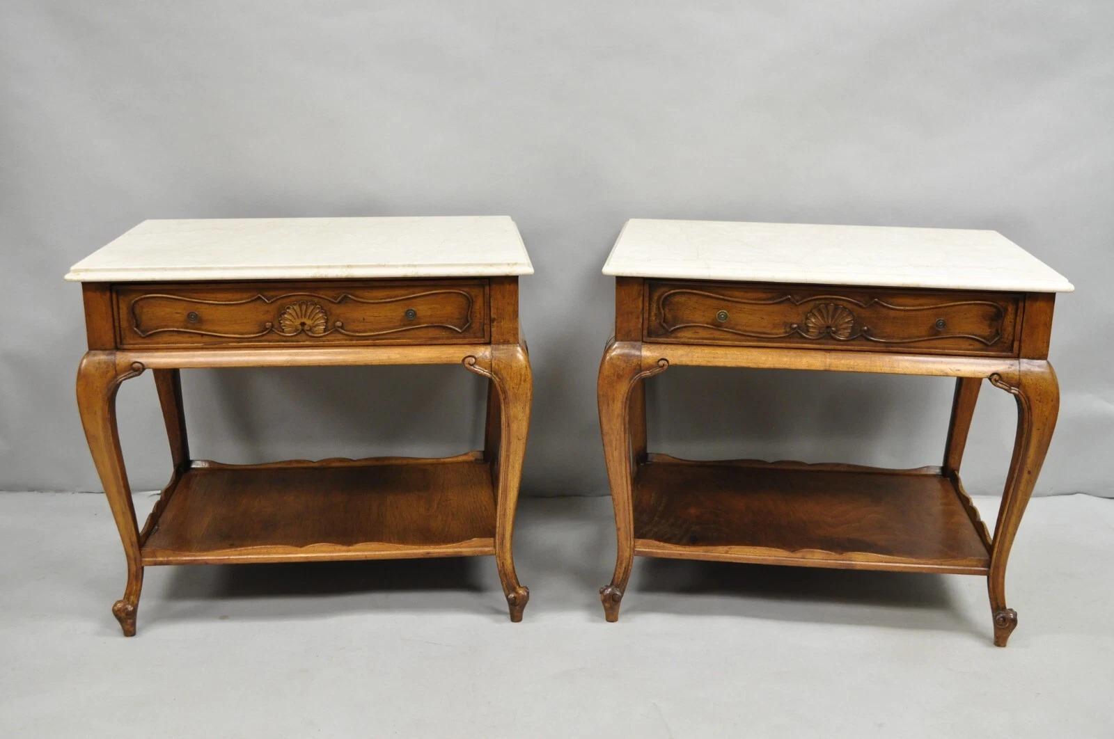 Vintage French Country Provincial Rectangular Travertine Marble Top Walnut End Tables - a Pair. Item features beige travertine stone tops, dovetailed drawers, shell carvings on all sides, lower shelf, and shapely cabriole legs. Circa Mid 20th