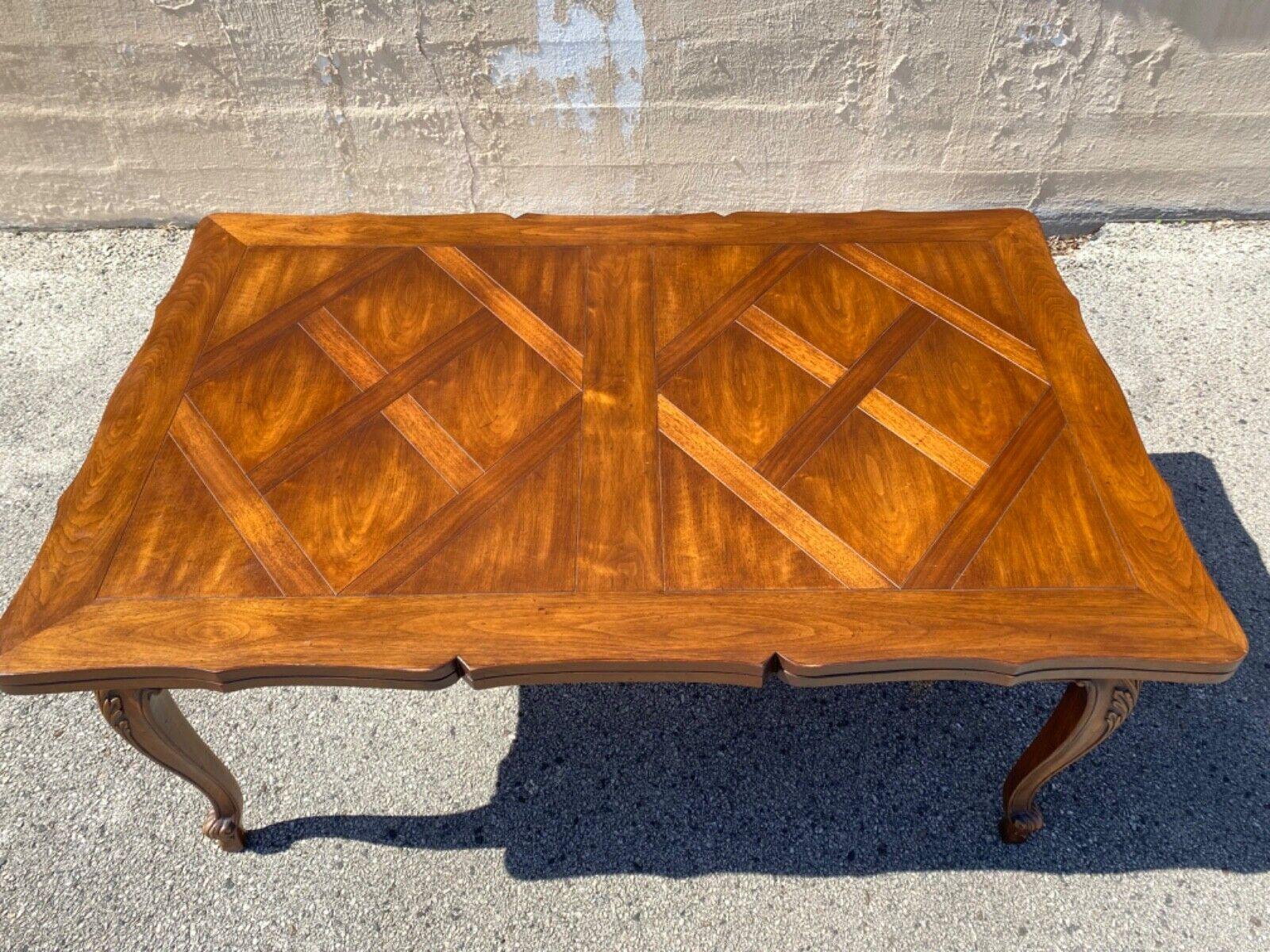 Vintage French Country Provincial Style Walnut Parquetry Inlay Extension Dining Table. Item features beautiful solid wood construction, shapely cabriole legs with floral carved knees, stunning parquetry inlaid top and extension leaves, high quality