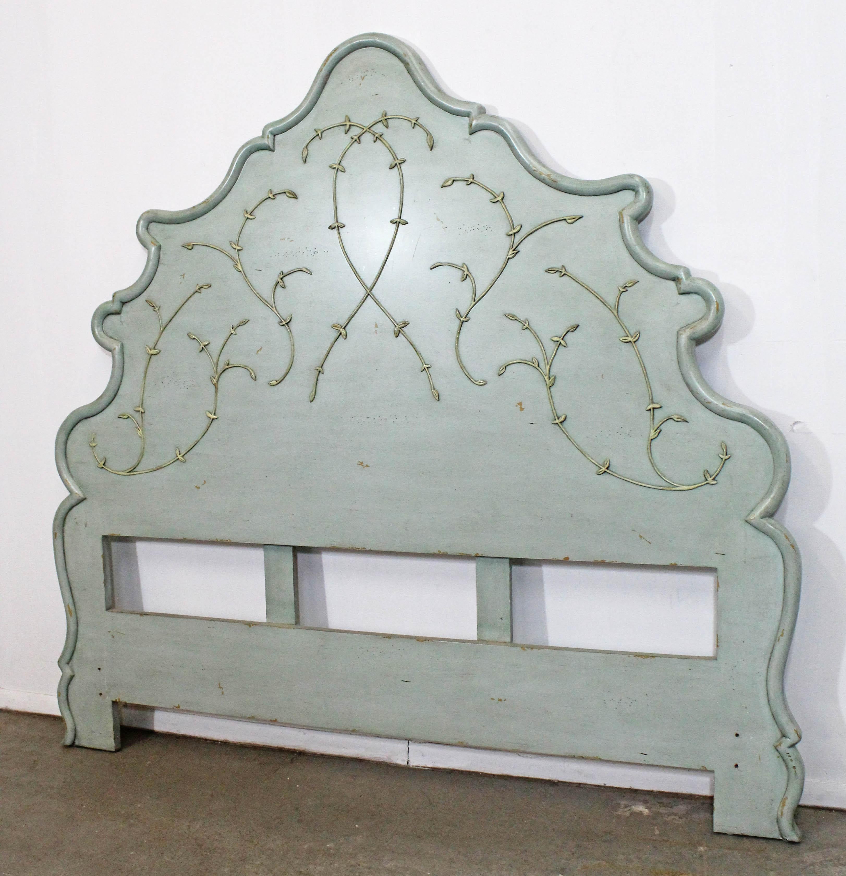 Offered is a beautiful, rustic French Country headboard for a queen size mattress. This headboard is painted in a light teal and features an ornately carved design with a slightly distressed look. The piece is in great condition with little wear.