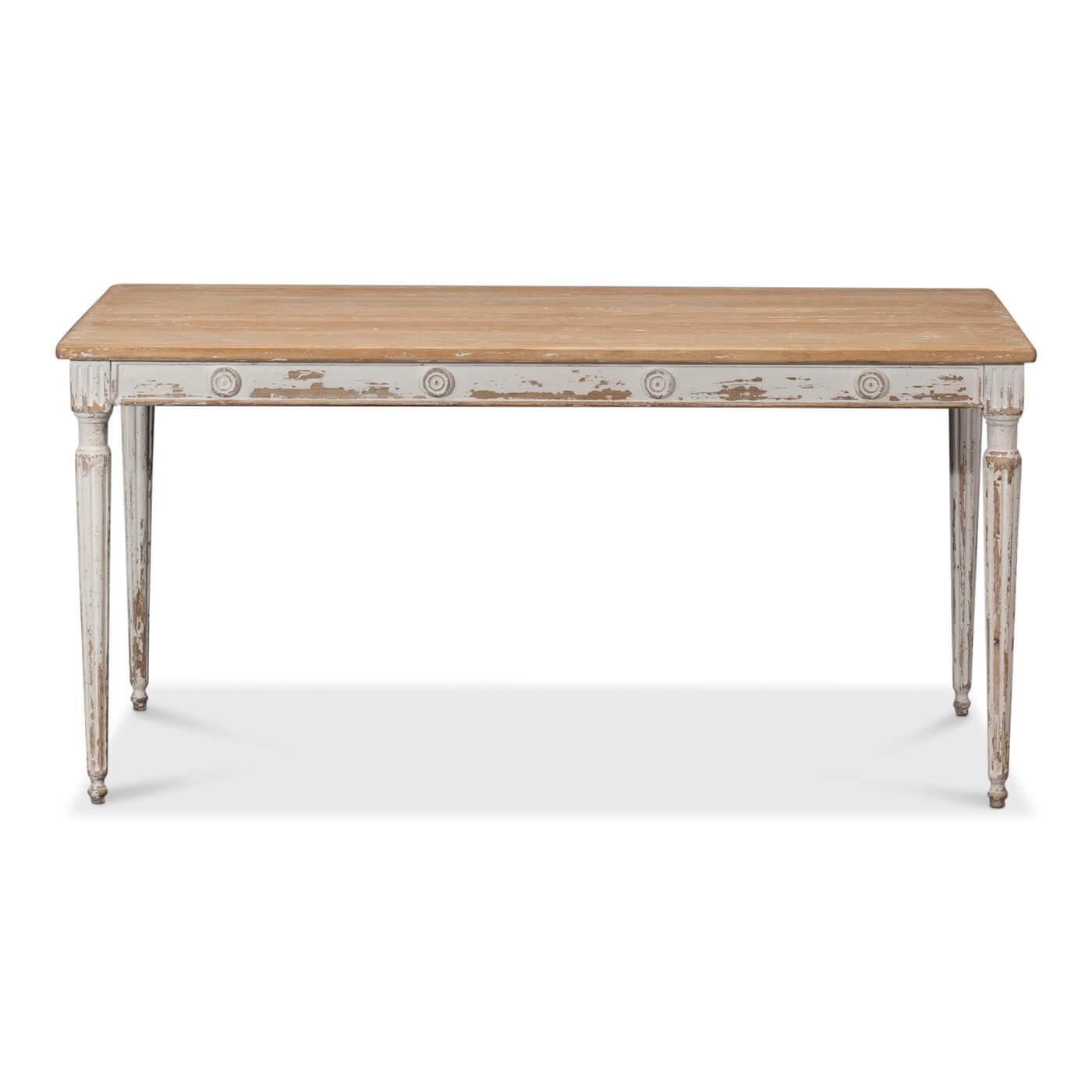 French Country rustic style dining table with pine top. The table apron has medallion accents and sits upon white distressed turned, tapered, and fluted legs. 

Dimensions: 63