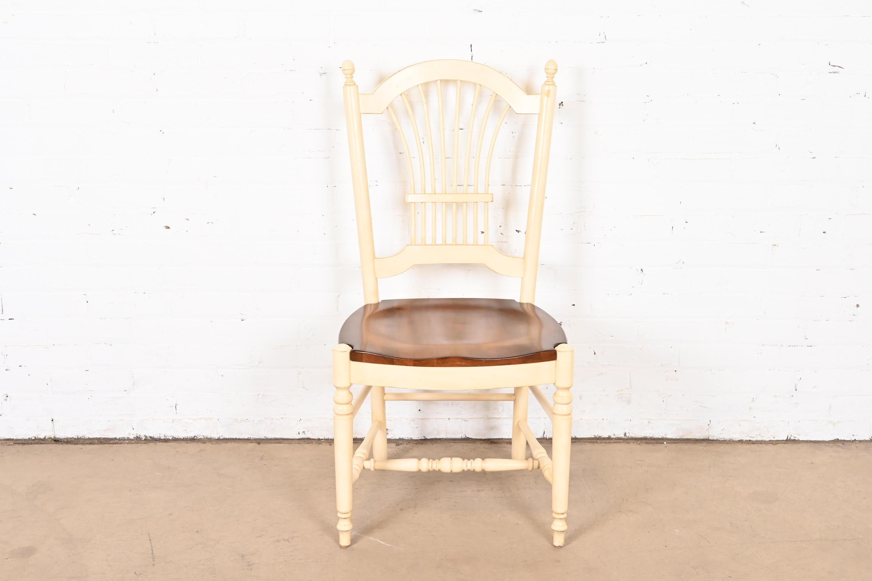 A lovely French Provincial or French Country style desk chair or side chair

USA, Circa 1990s

White lacquered solid maple, with natural maple seat.

Measures: 20