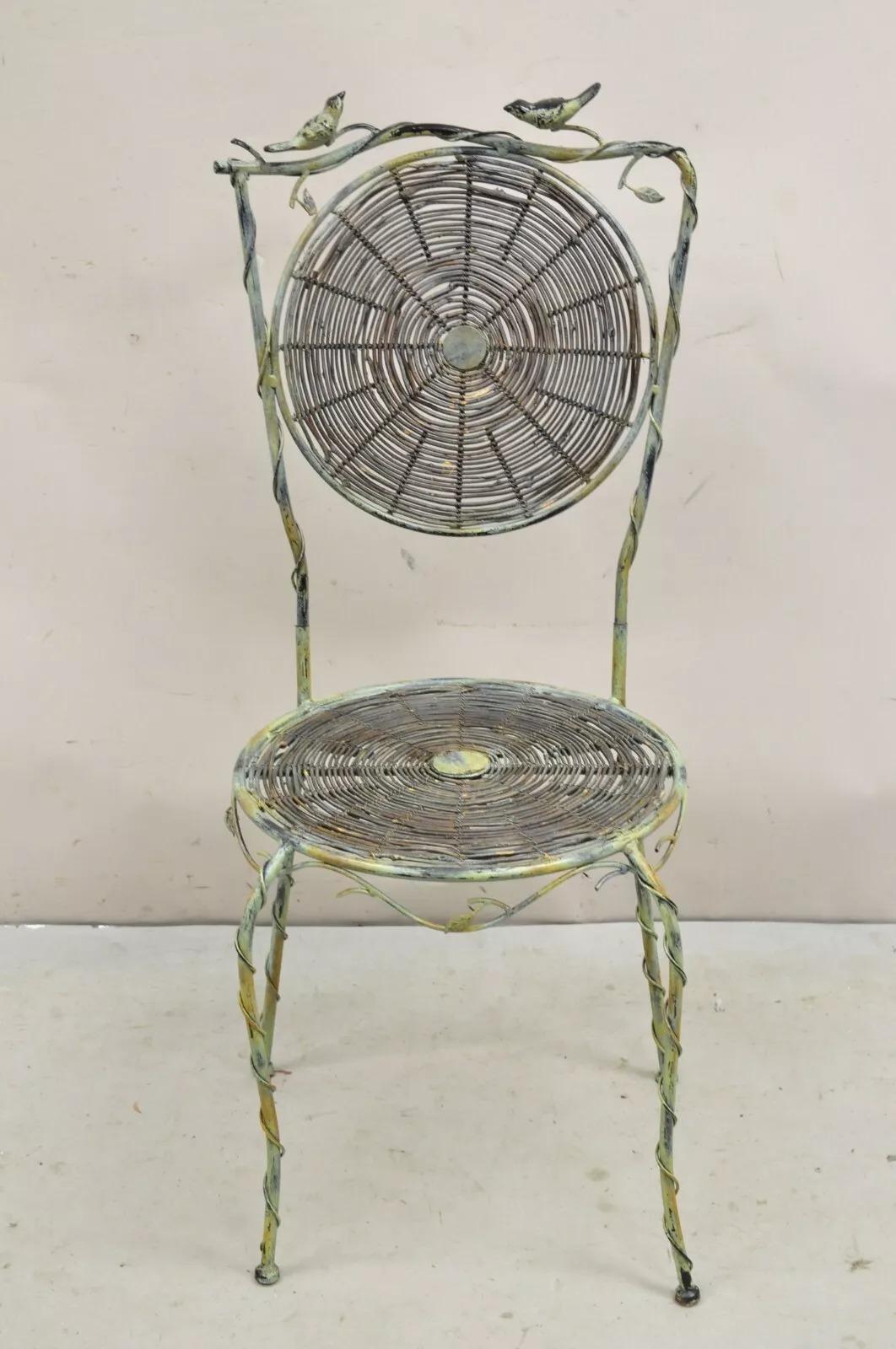 French Country Style Iron and Wood Reed Green Bistro Side Chair with Birds. Item features an iron frame with wooden reed woven back and seat, and green distress painted finish. Chair can be disassembled for shipping as can be seen in the photo.