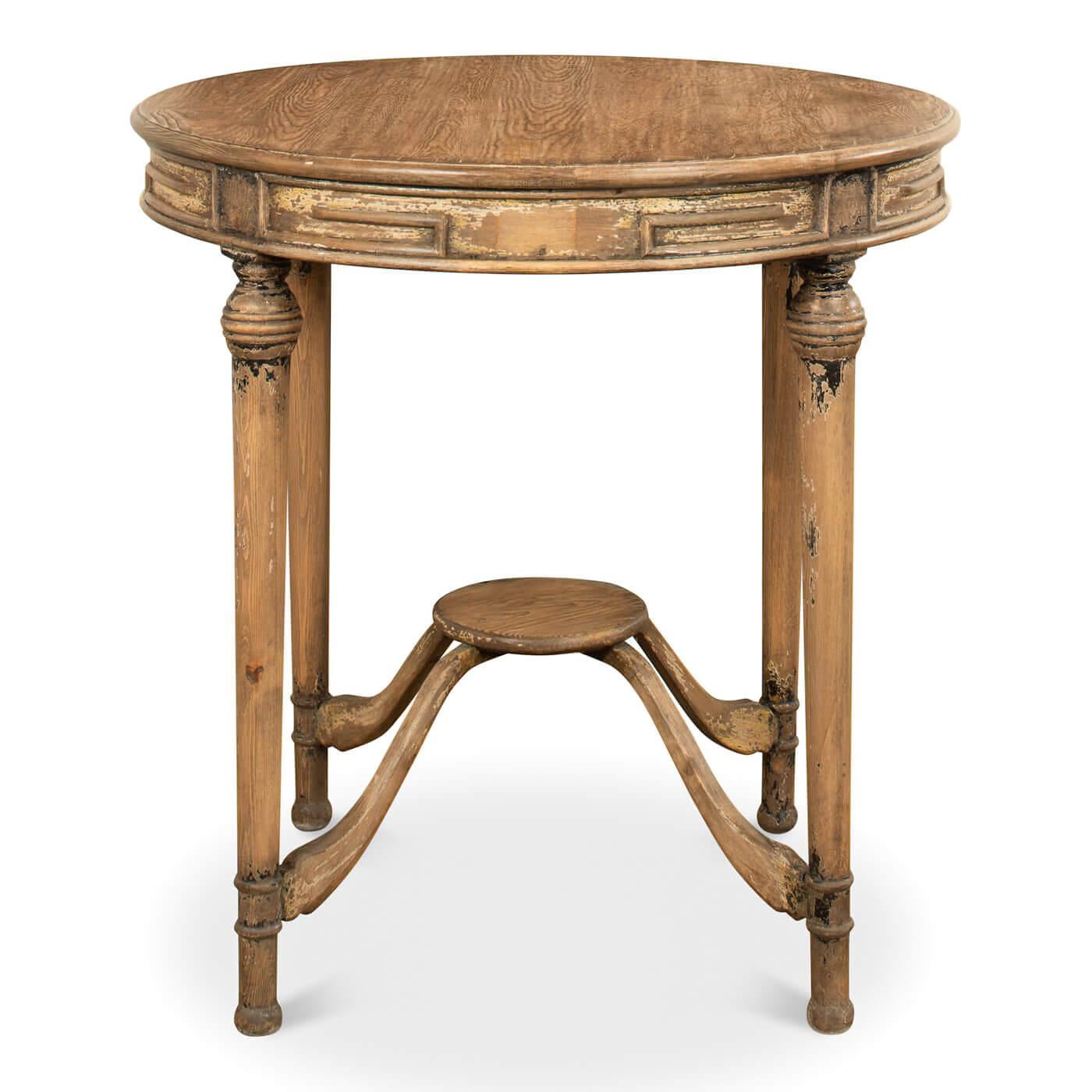A rustic French country-style tea table. This table has an antiqued finish giving it the look and feel of a treasured heirloom. The round pine top has a warm brown finish and sits on a lovely curved stretcher base.

Dimension: 30