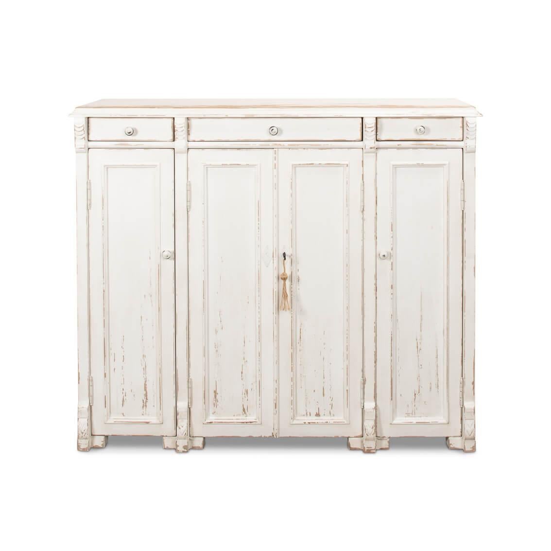 This charming piece captures the spirit of a quaint provincial cottage with its lovingly distressed whitewashed finish and classic paneling. The traditional craftsmanship is evident in the fine details, including the elegant molding and the