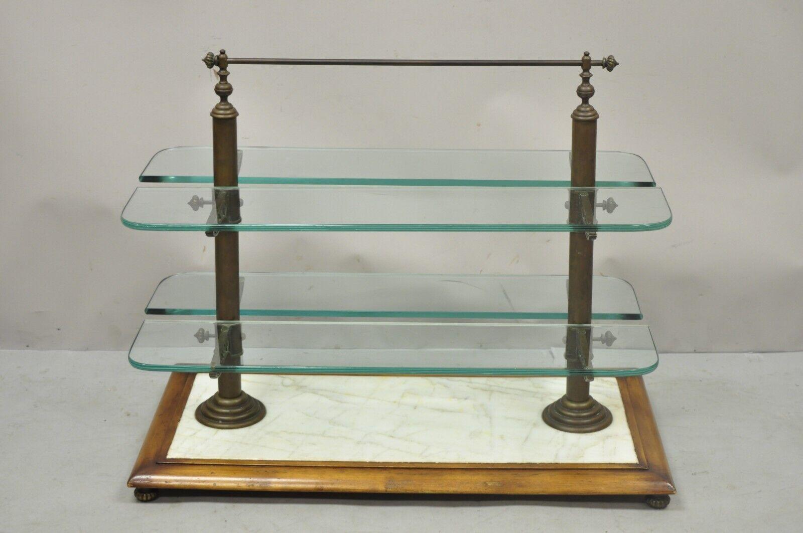 Vintage French Country Walnut Marble and Bronze Patisserie Pastry Shelf Display Stand. Item features adjustable height shelves, marble surface, raised on bronze feet, bronze and brass painted hardware, solid wood base, 4 thick curved glass shelves,