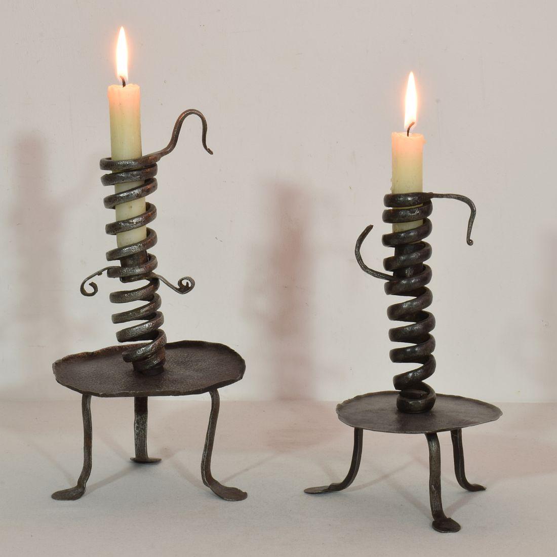 Wonderful and extremely rare couple of wrought iron rat de cave candle holders, Normandie, France, 18th century. Weathered and minor losses. More photo's available on request.