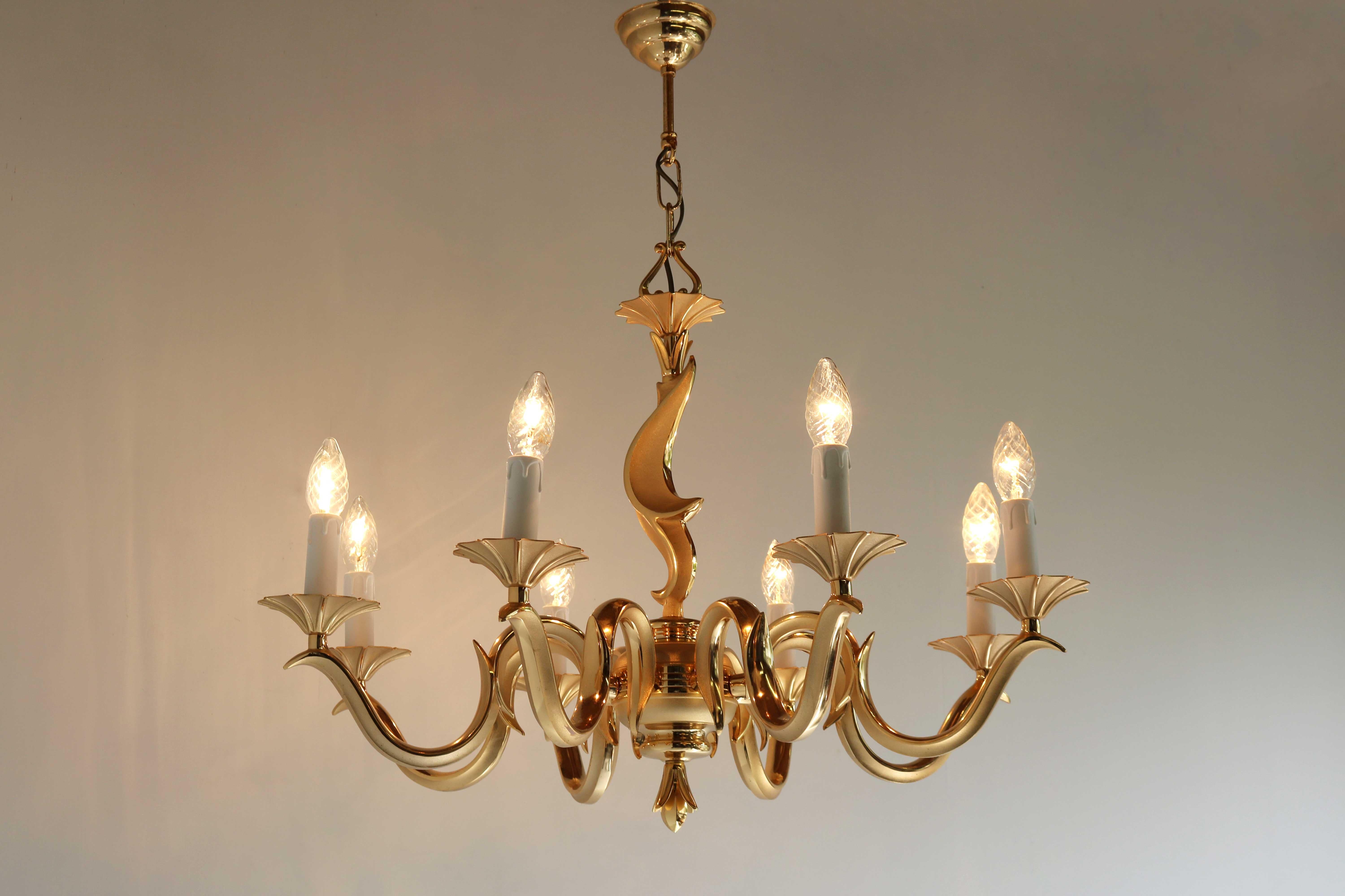 French Couple / Set Golden Chandeliers Hollywood Regency Style Metal/ Brass 1970s 
Elegant Hollywood Regency style set golden chandeliers, couple presented in French Gold and Satin finishes, to enhance the ribs of the individual leaves.
Both in good