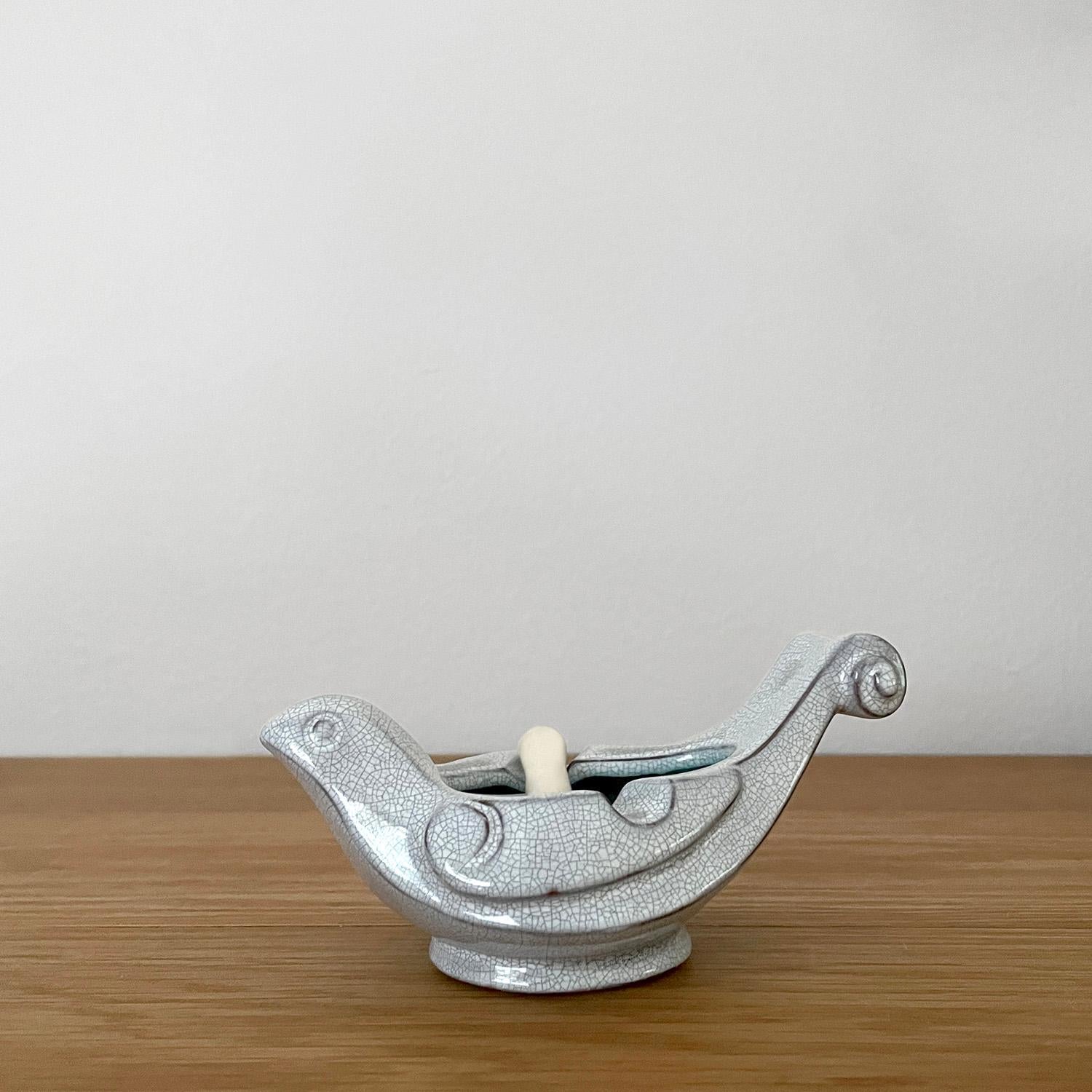 

French crackle ceramic dove mortar & pestle
France, circa 1940s 
This petite mortar & pestle set is both delicate and darling 
Beautifully sculpted bird mortar has wonderful veining detail throughout 
Interior and exterior of the vessel have
