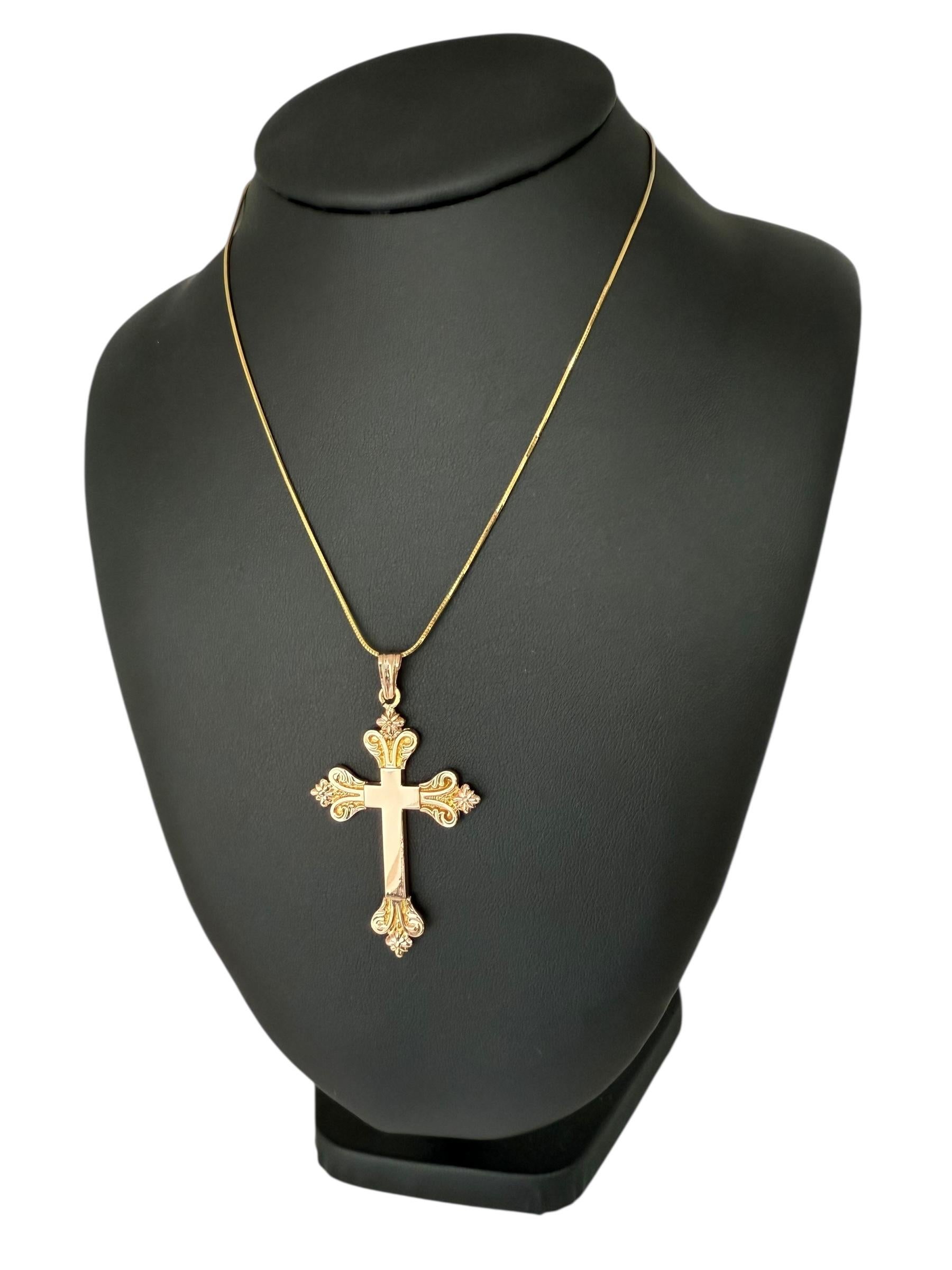 This elegant French Cross is crafted in 18-karat rose gold and showcases a refined Fleur-de-Lys design—an enduring symbol of French heritage and nobility. Featuring a polished surface that highlights the warm, rosy hue of the gold, the cross is both