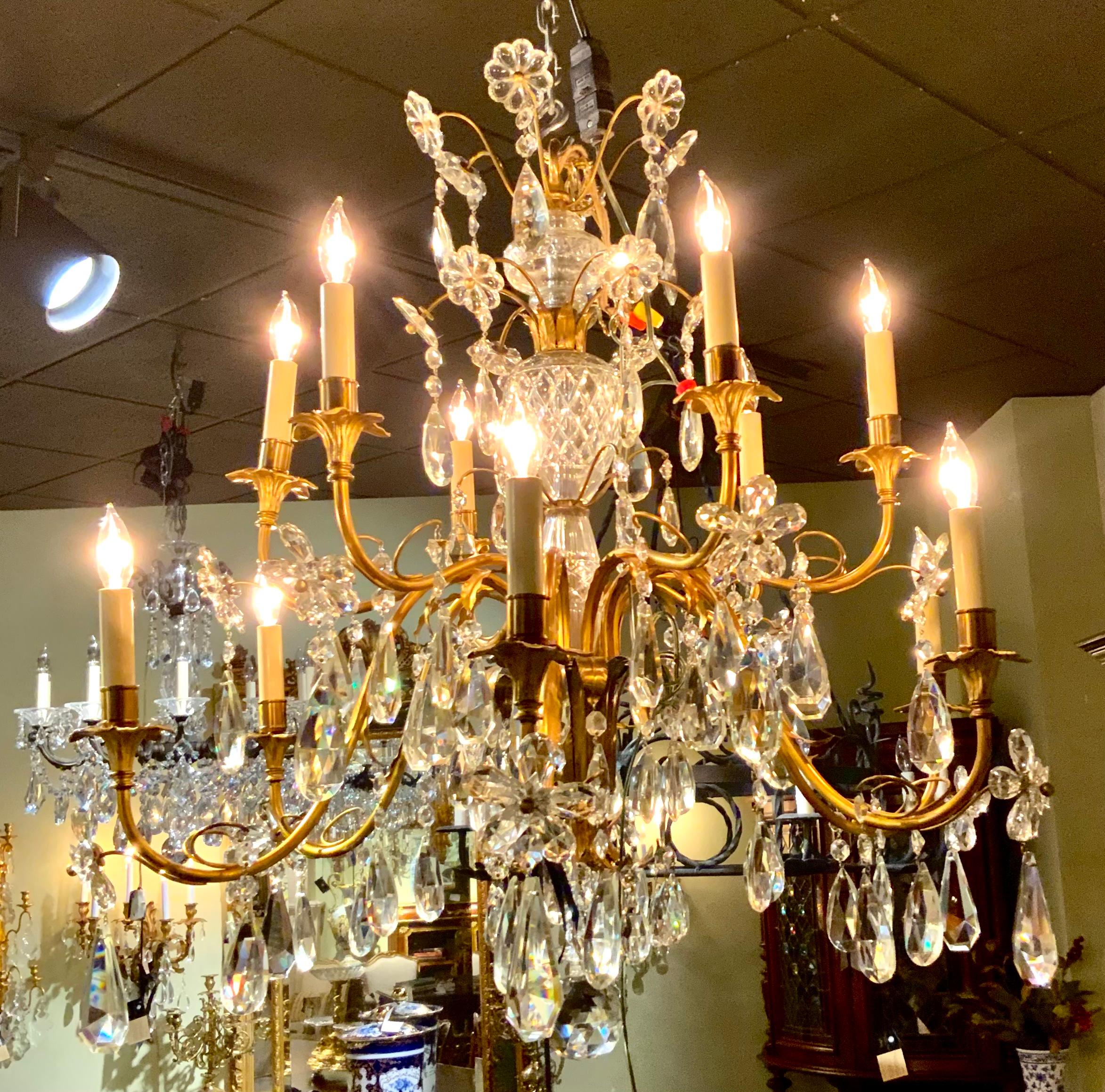 Elegant and brilliant crystal make this piece sparkle. It
Has scrolling arms with ten lights. It has a crystal post
Throughout the entire height of this piece. It has good
Wiring and it is ready to install. There are no broken 
Or chipped crystals.